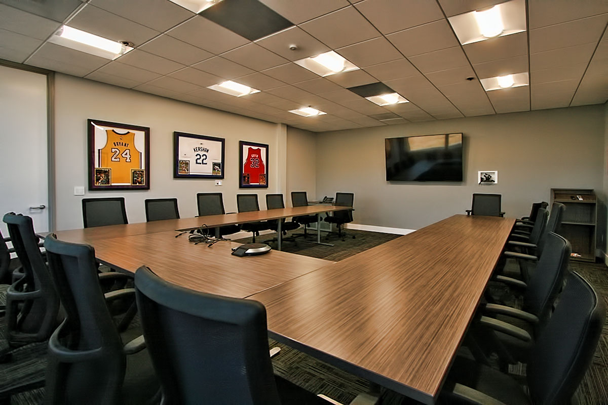 Conference room featuring memorabilia displayed on the walls, adding a personal touch to the space.