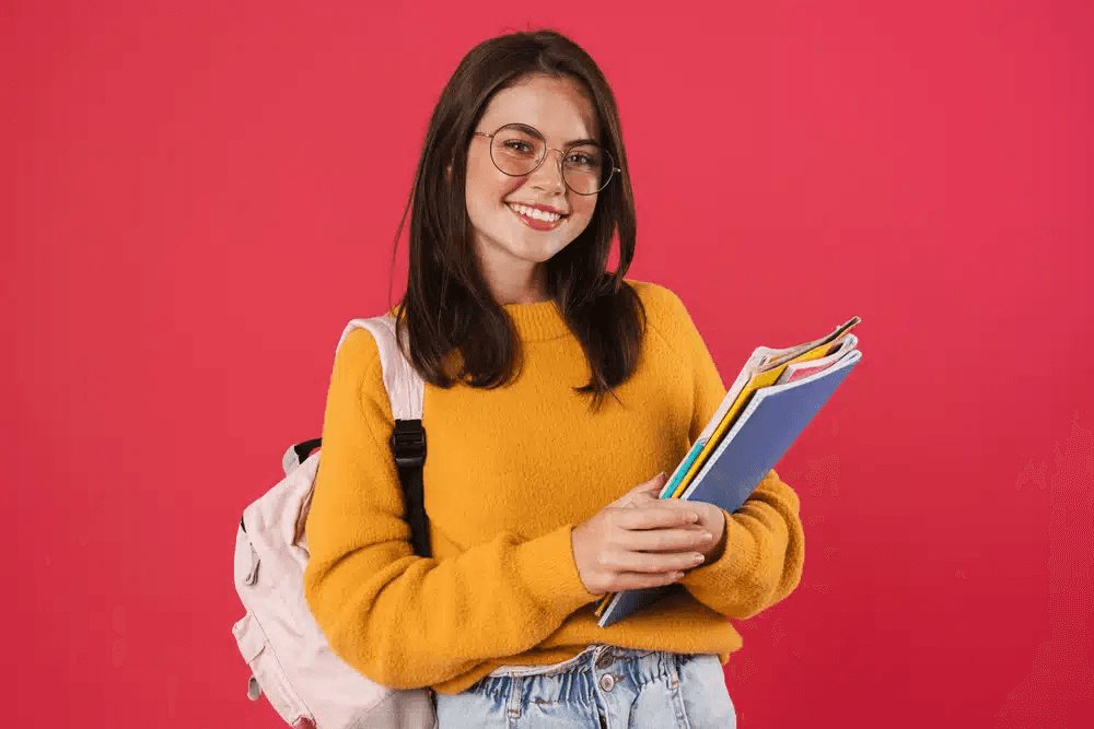 High school student submitting research paper to Curieux Academic Journal on a laptop