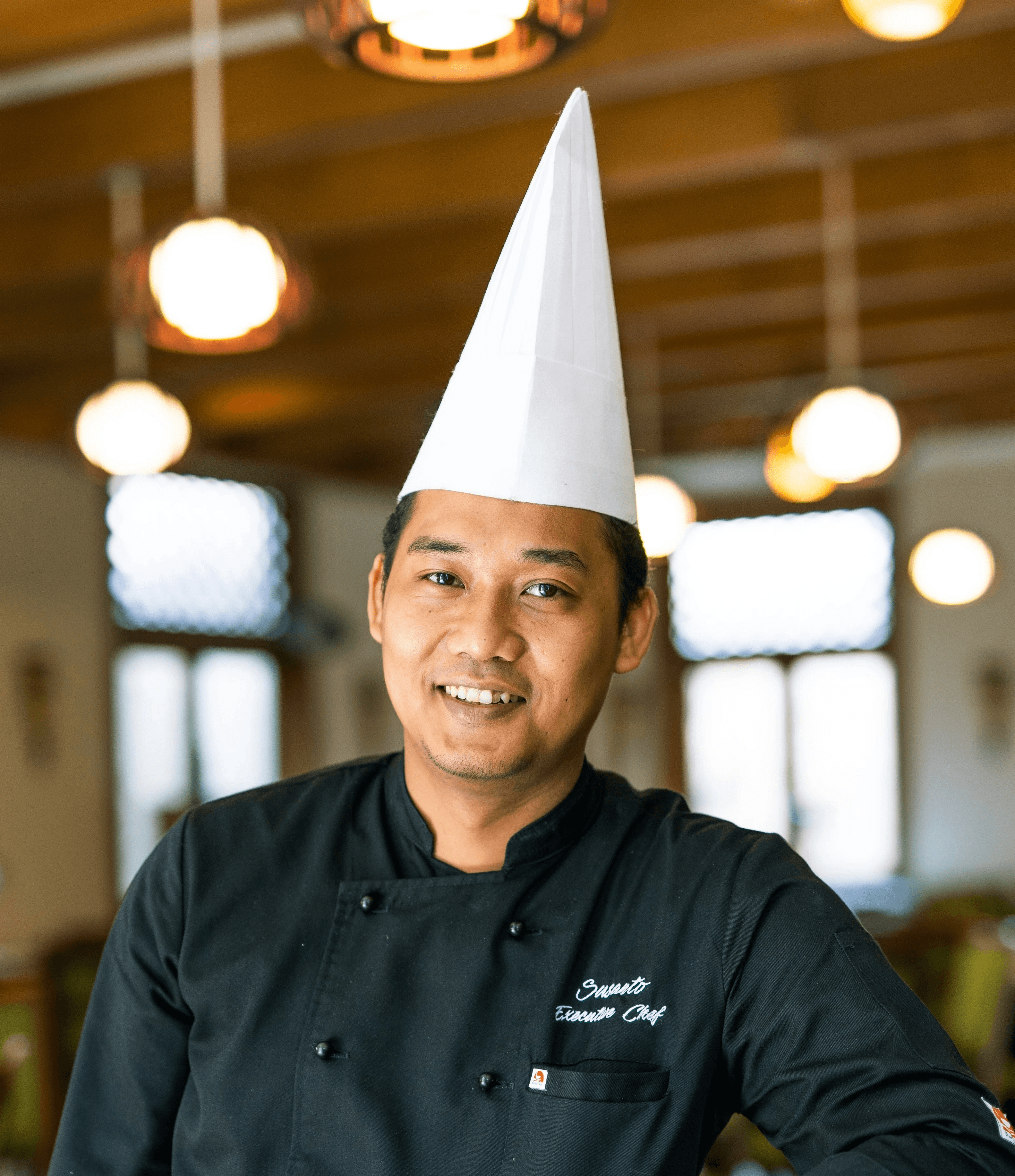 man in black nike jacket wearing white cap