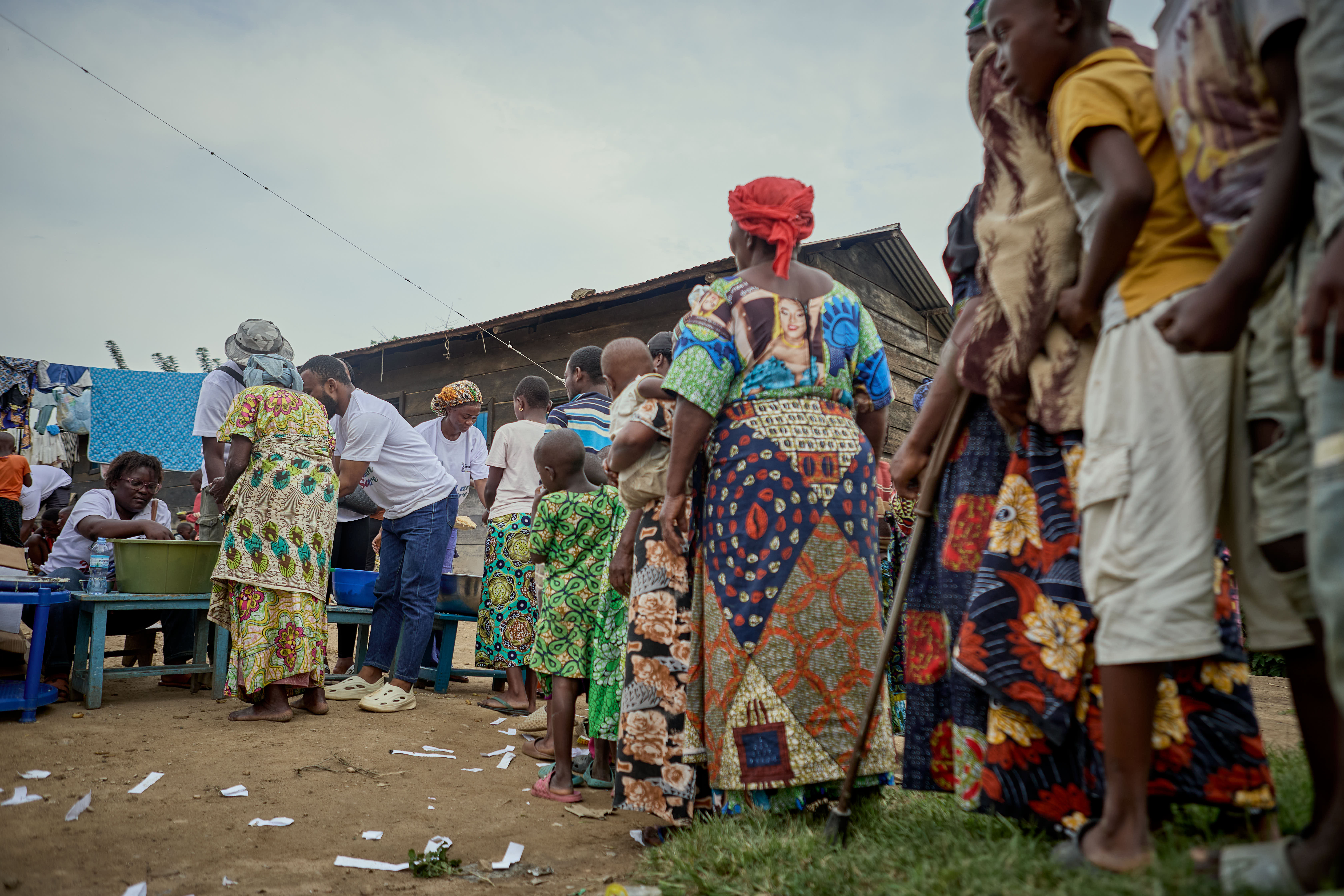 selective focus photography of woman standing surrounded by plants