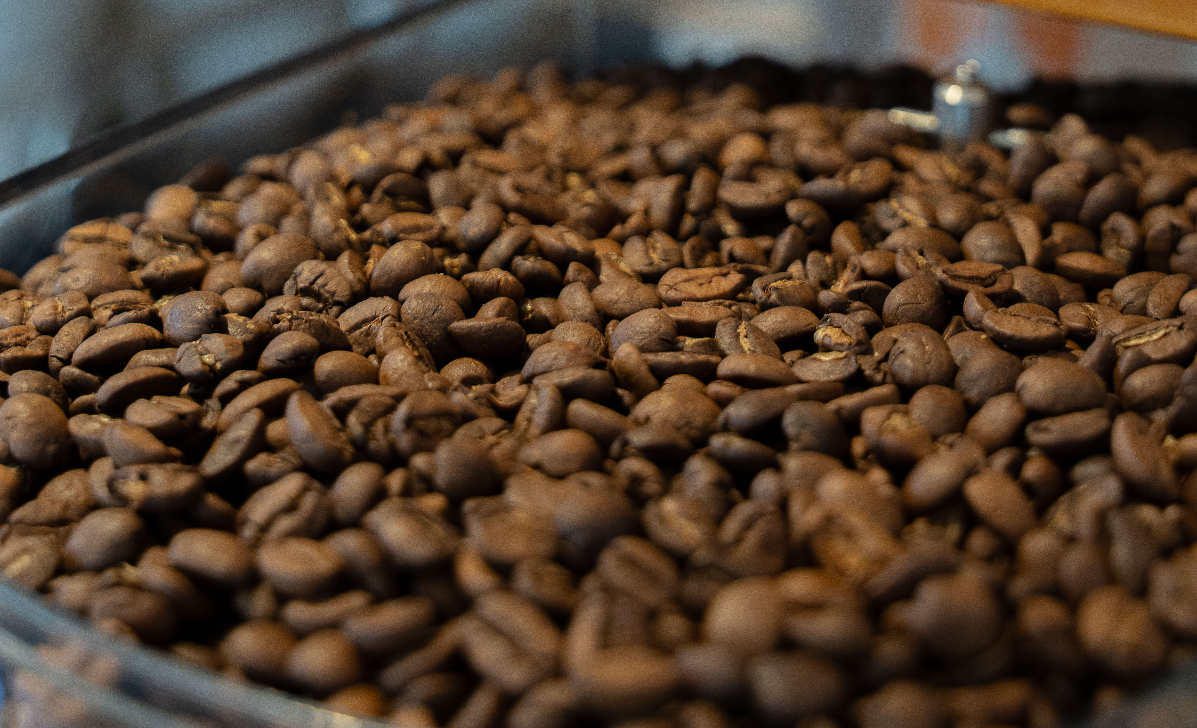 two clear drinking glasses on top of brown wooden table