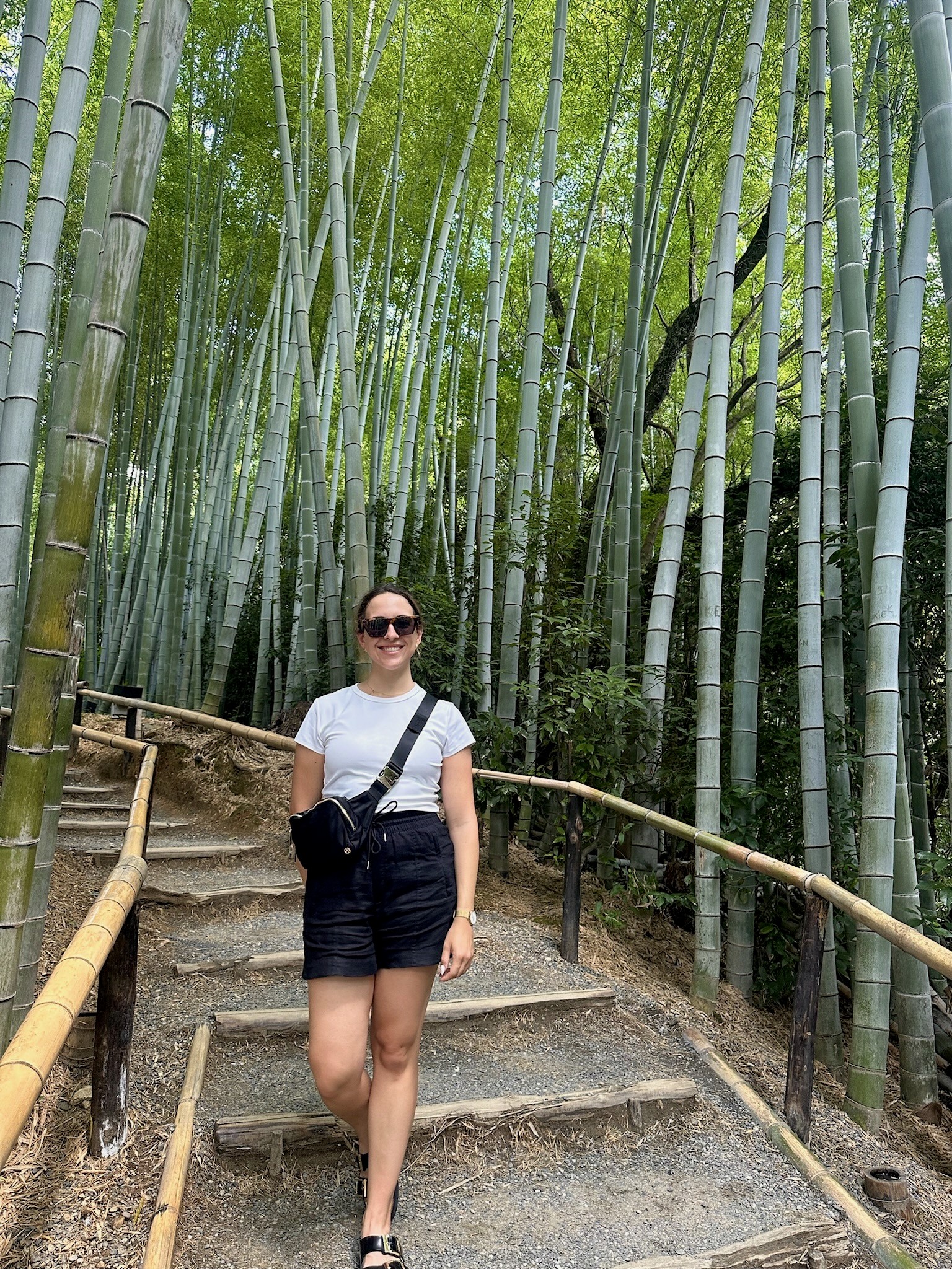 Woman walking down stairs in Japanese Bamboo Forest