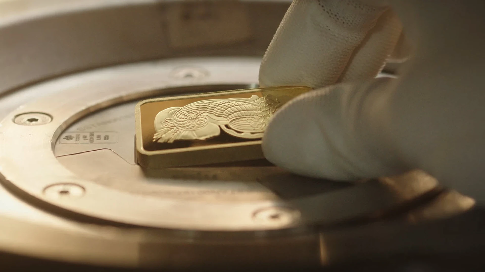 PAMP Suisse gold bar being handled at vaulting facility, Castel San Pietro