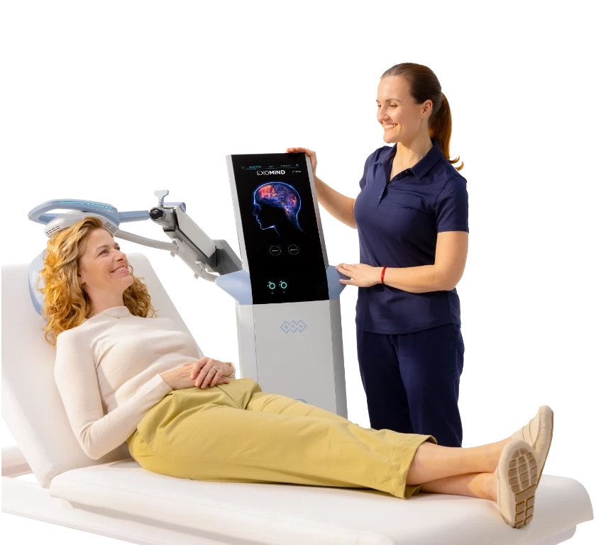 Happy Nurse and patient with exomind machine