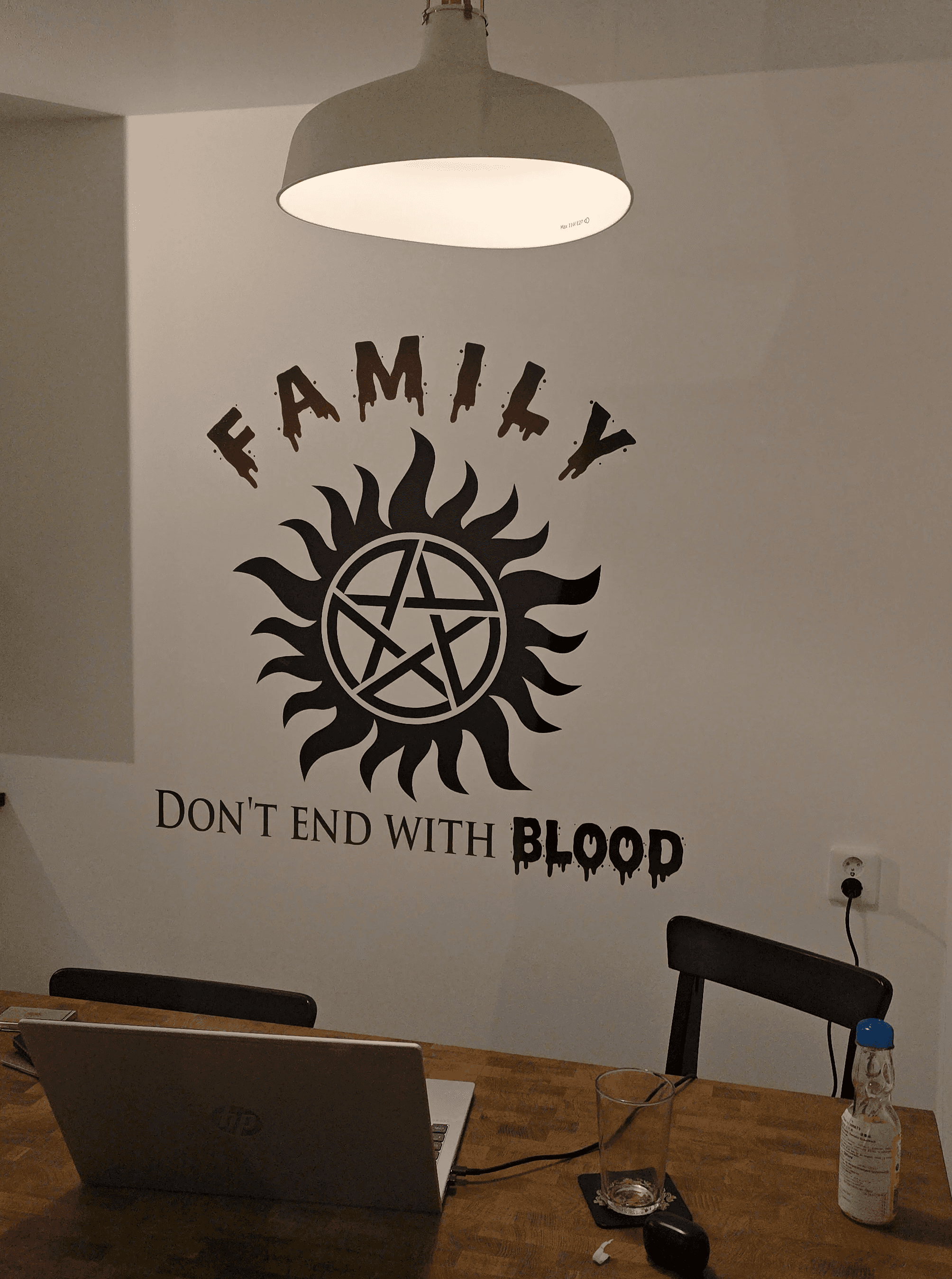 Single tree in a field with light rays.