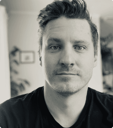 black and white photo of matthew ravenhall in a black shirt at experieco