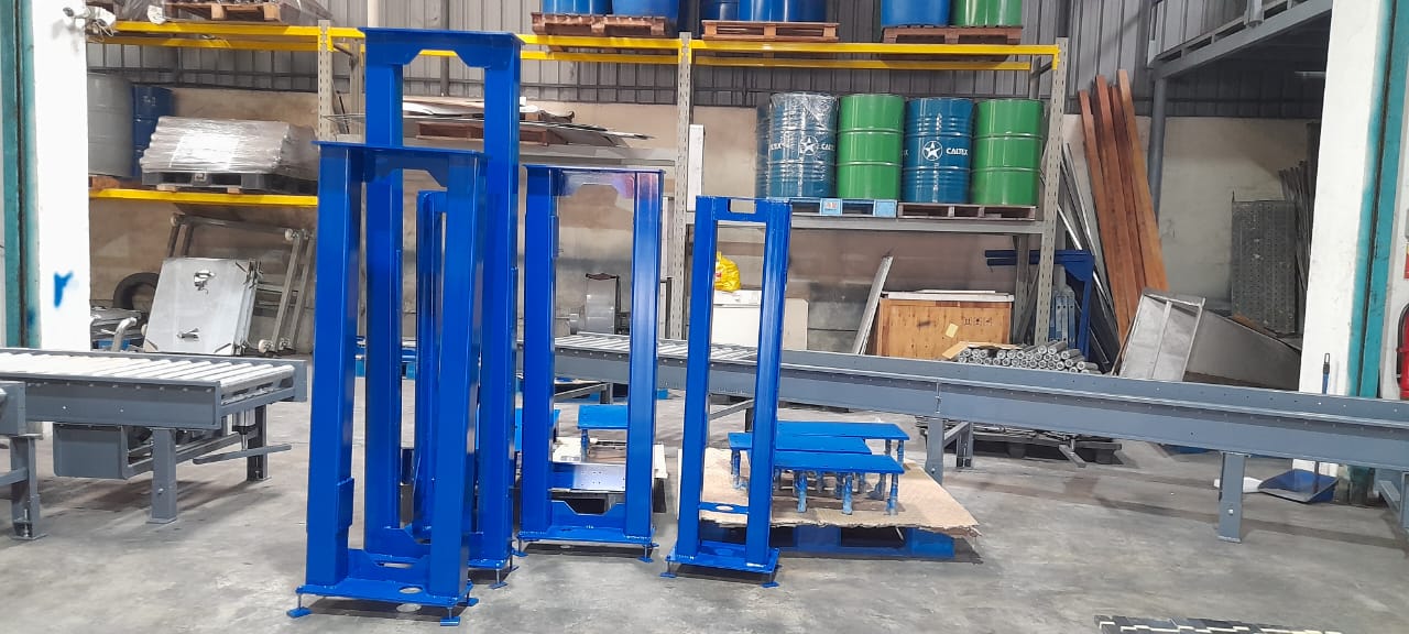 Assembly of the main filling machine structure on the workshop floor.	