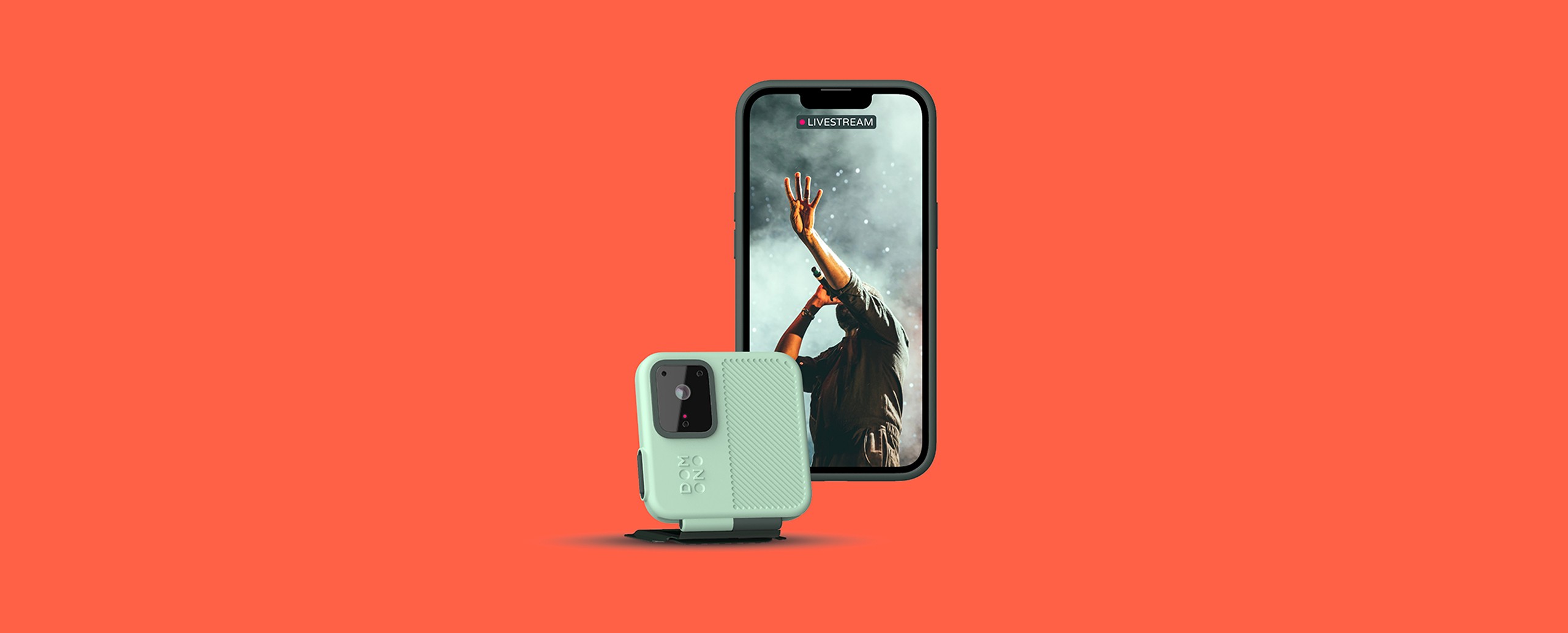 Portable action camera designed to slip on and off a phone case, attached to a smartphone displaying a concert video on the screen, highlighting a compact, easy-to-use design.