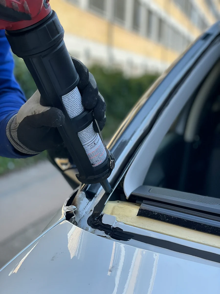 HyperAuto Care Glass & Water Spot Removal service in a professional auto care workshop