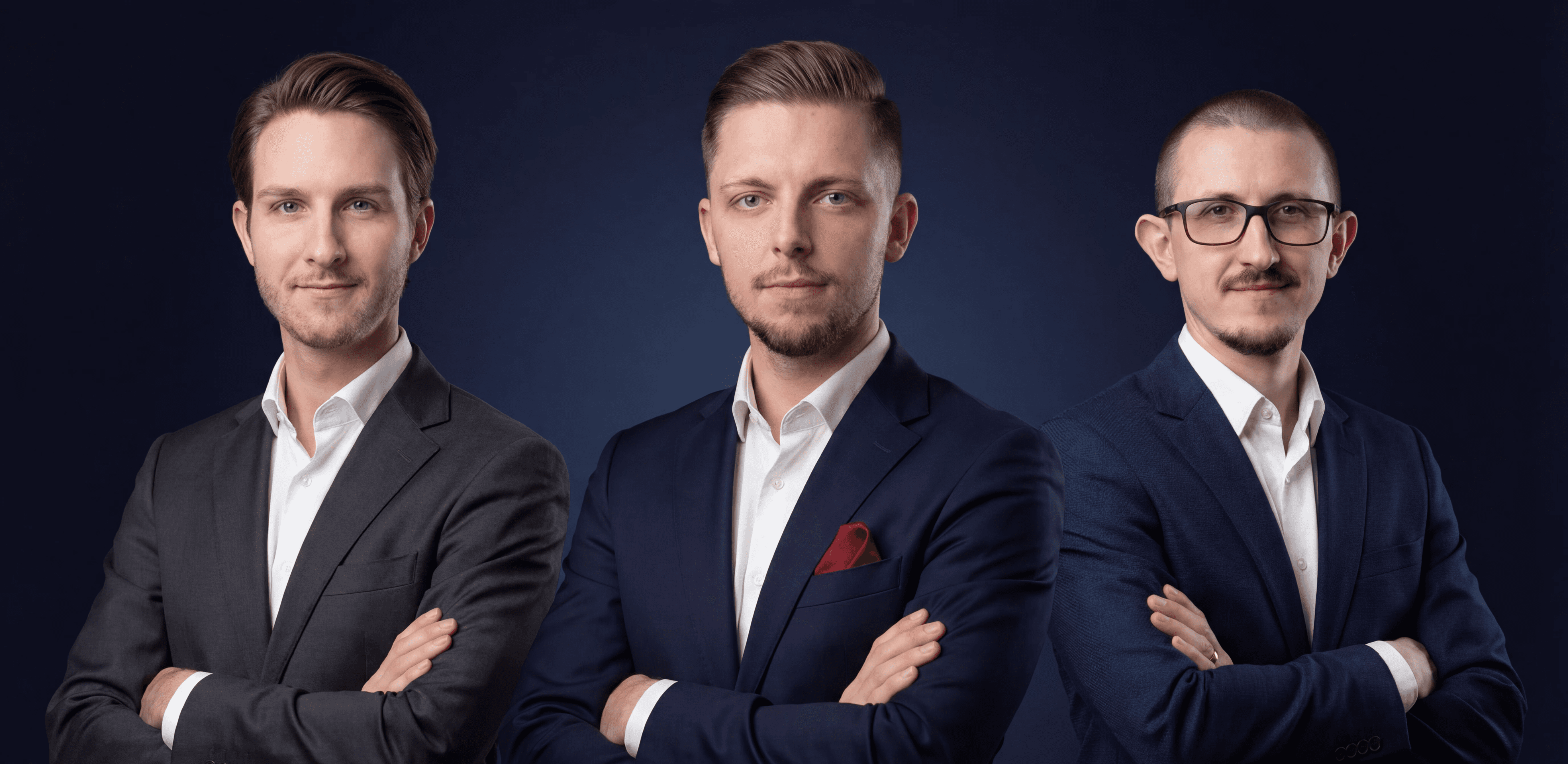 a group of people sitting around a laptop computer