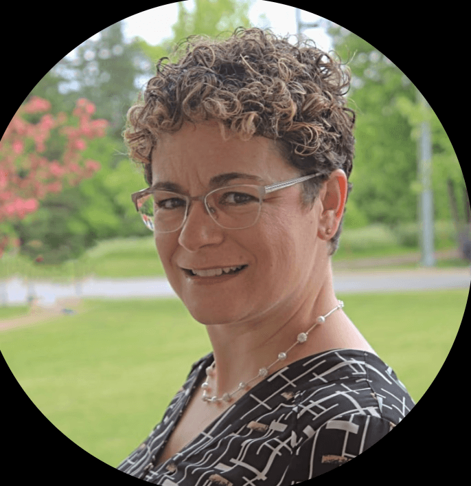 smiling woman wearing white and black pinstriped collared top