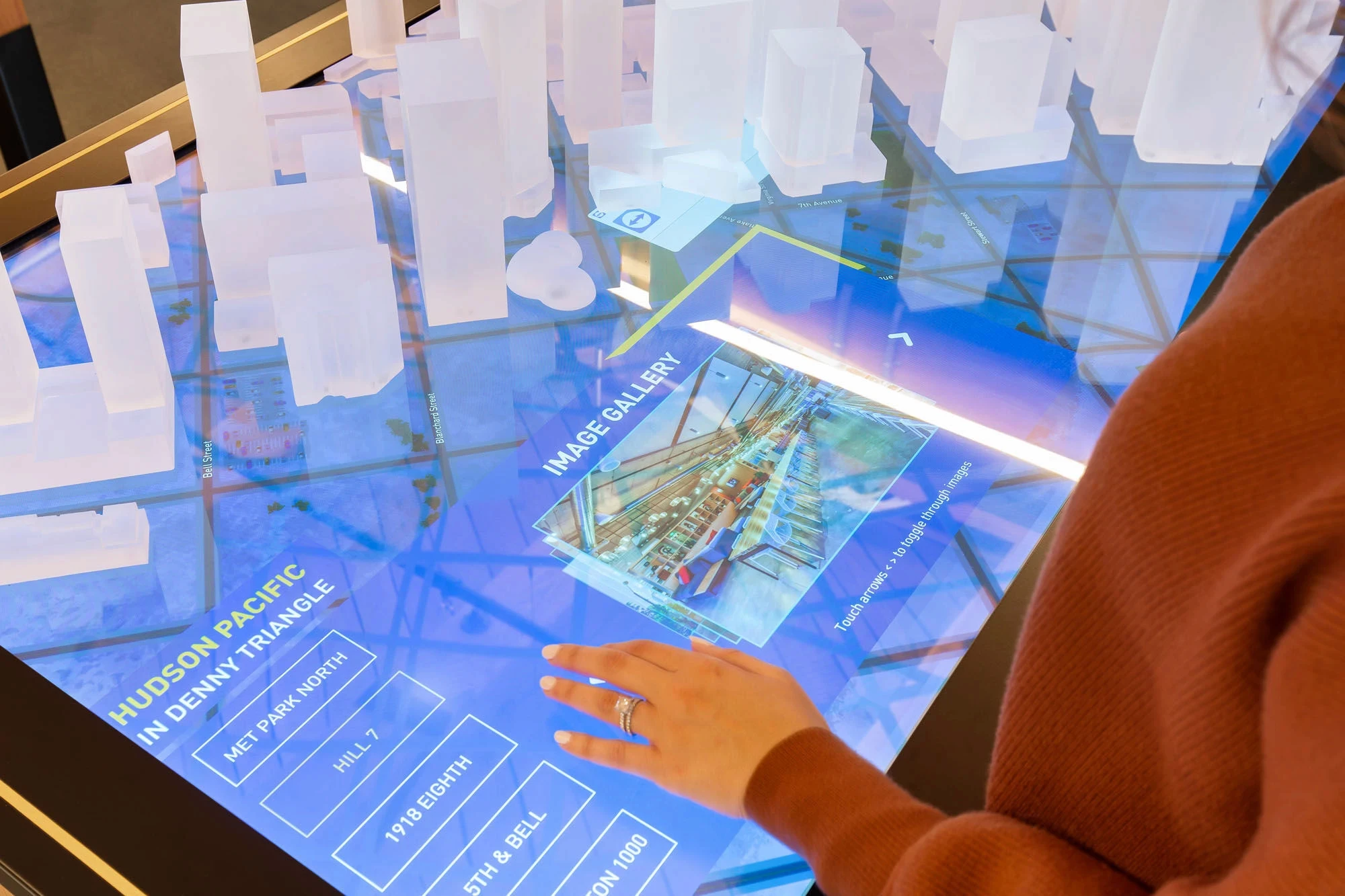 hudson pacific properities real estate showroom with table maps