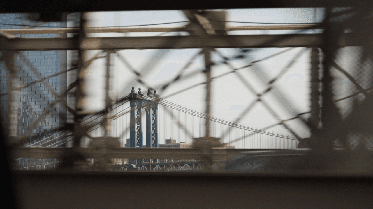 View through a window or glass, showing scaffolding or construction materials