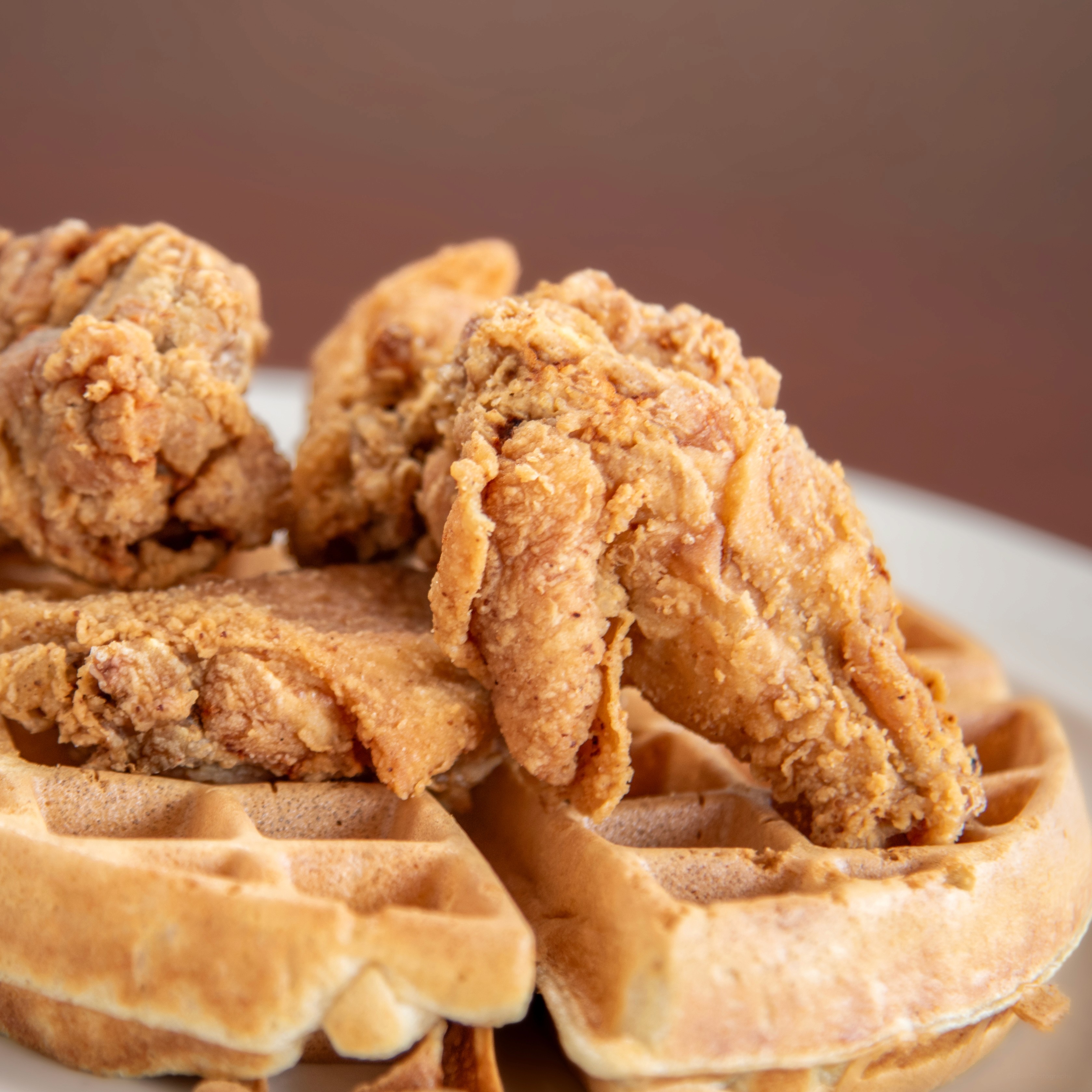 red and brown fruits on white ceramic bowl