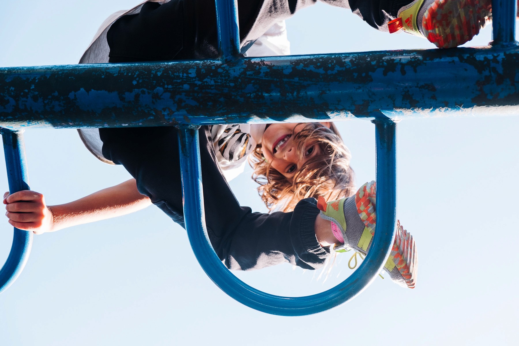 girl-climbing-blue-playground-fortgreene-nyc-lifestyle-photography