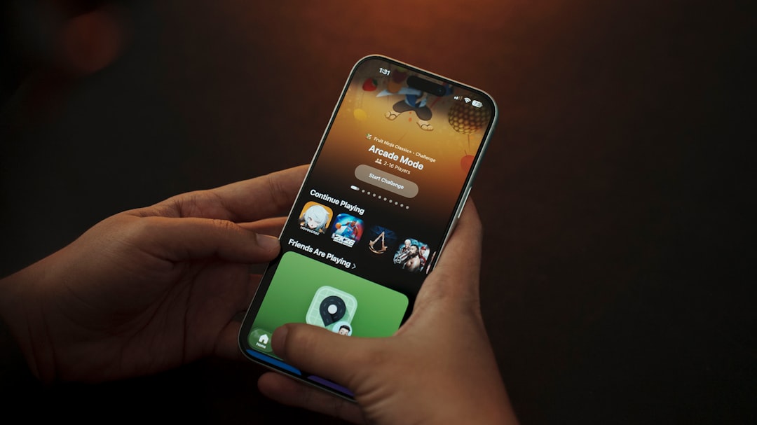 Person holding a smartphone with apps displayed