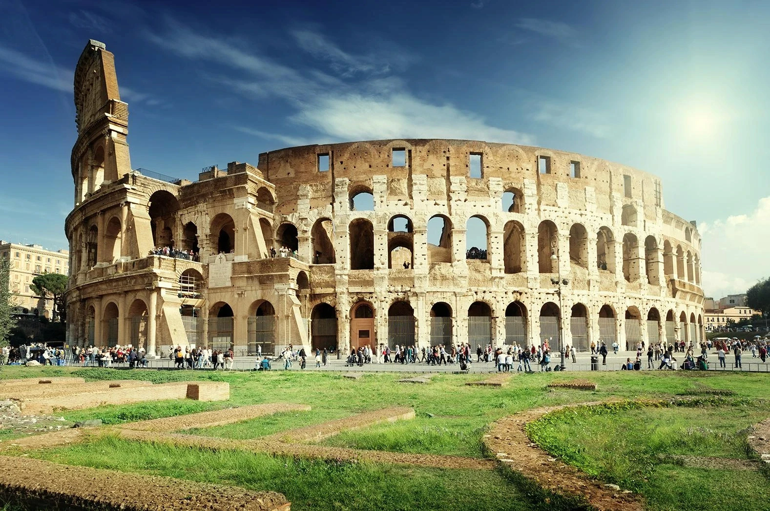 Ancient Colosseum under sunny sky