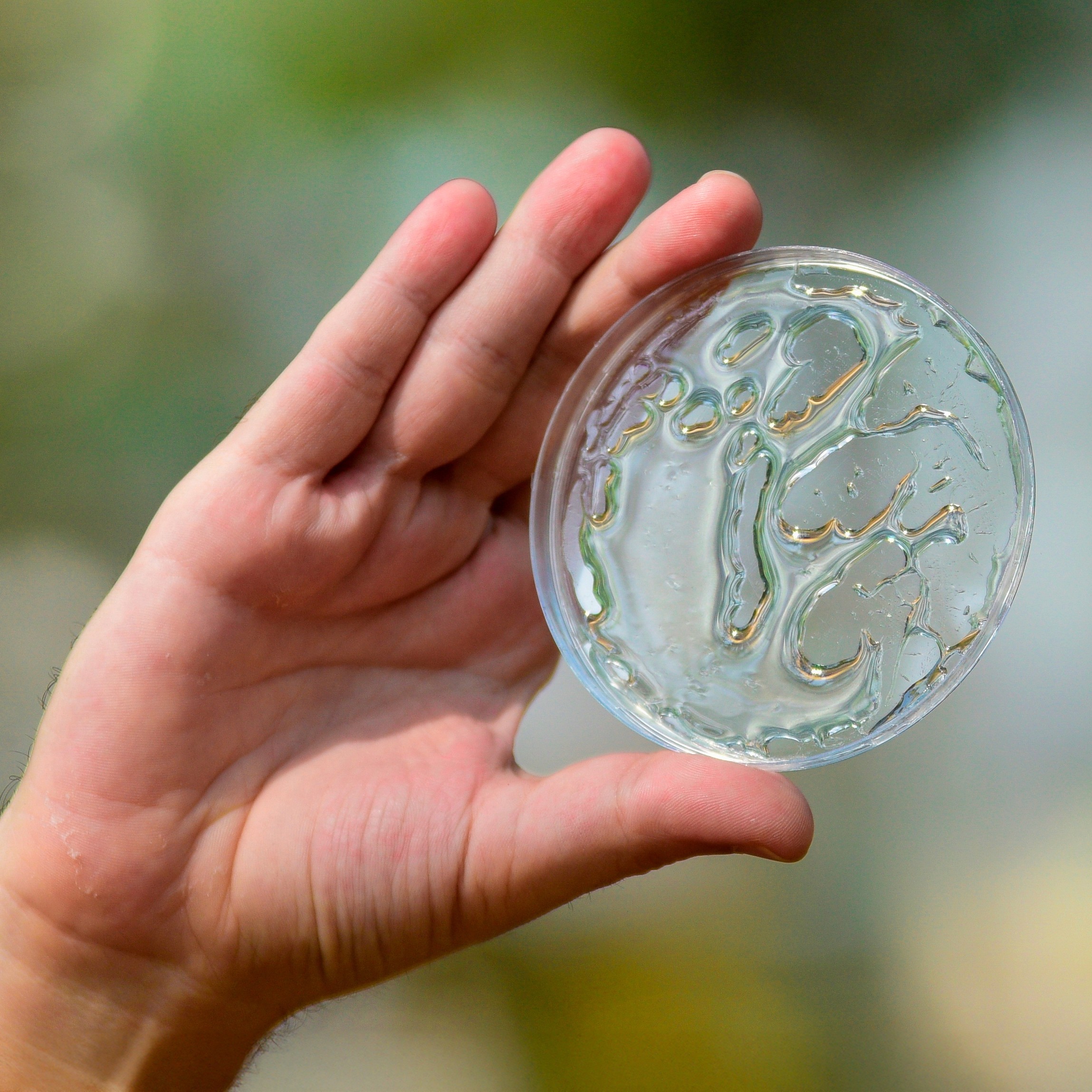 Farm fields with barn and mountains in background