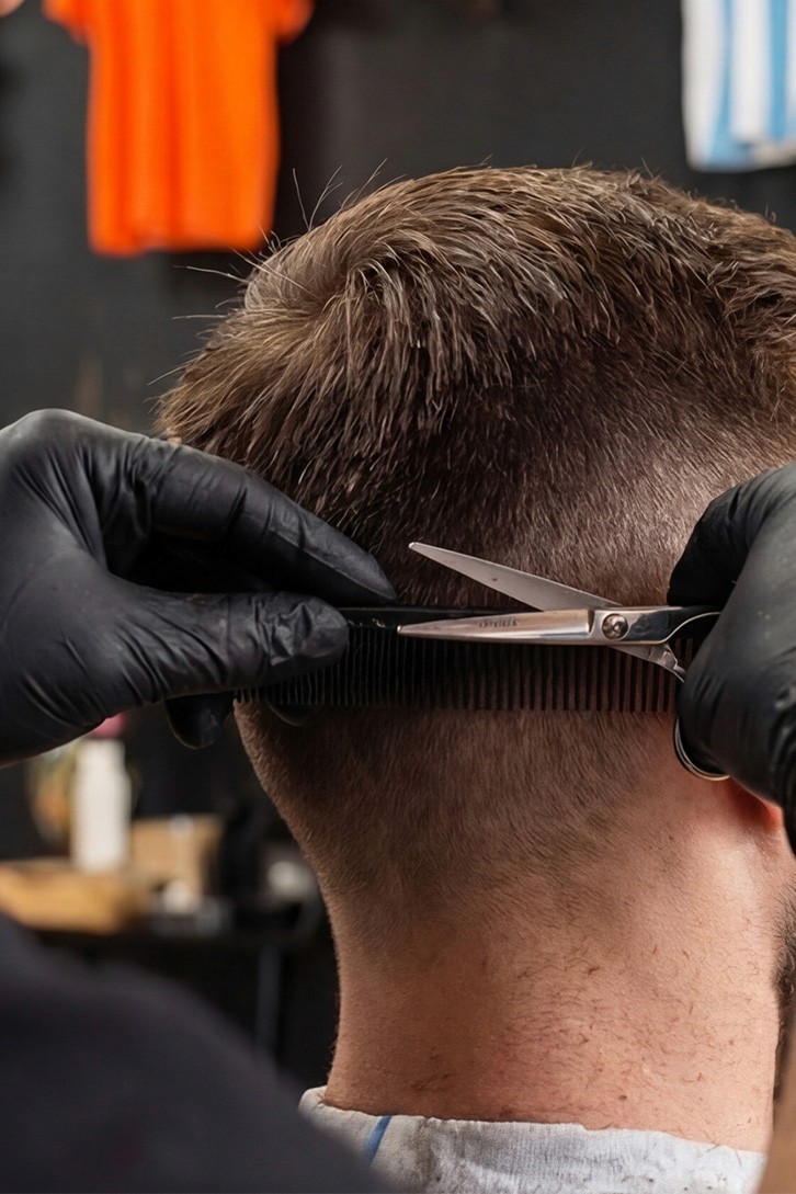 Man with beard getting hair blow-dried