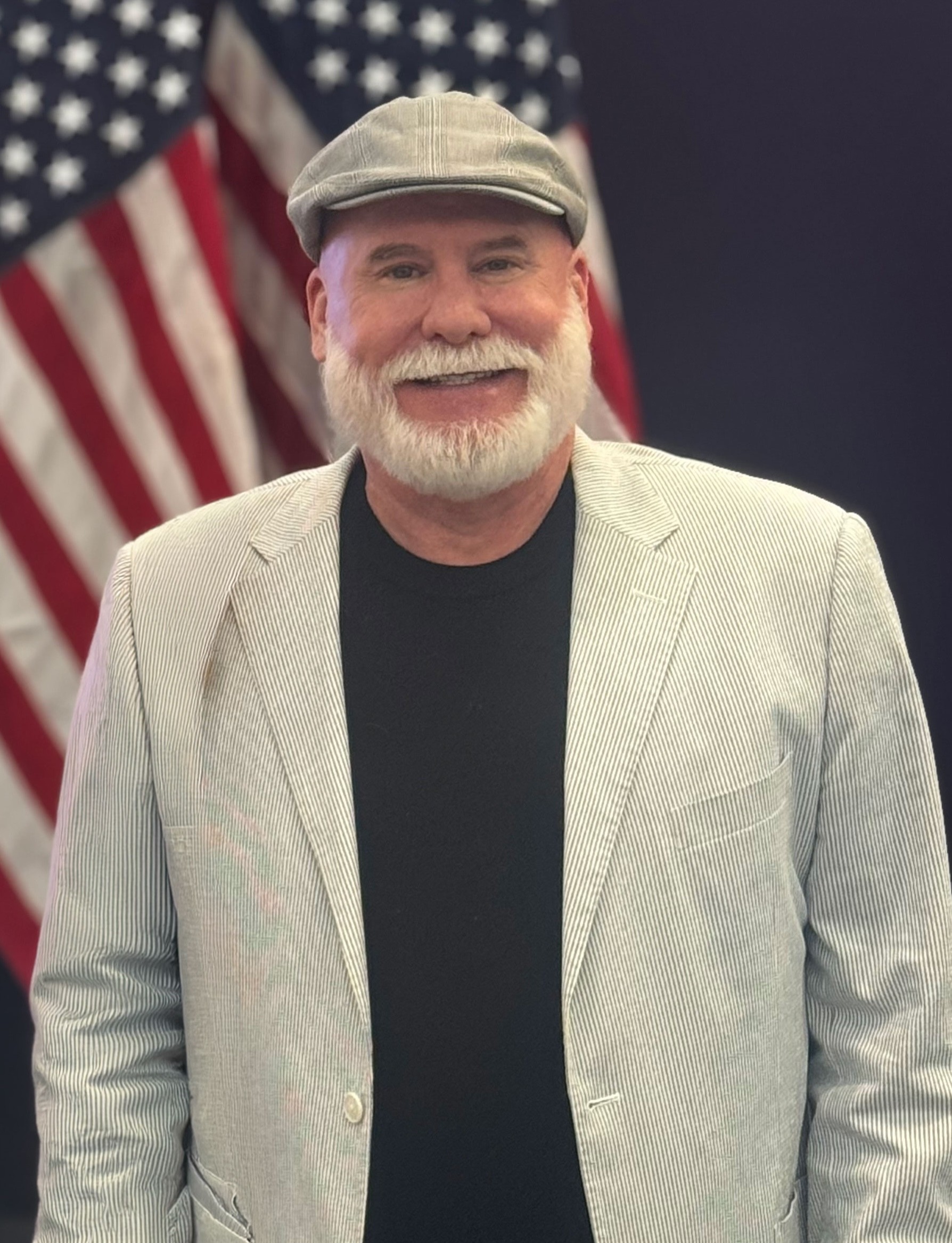 smiling woman in brown blazer