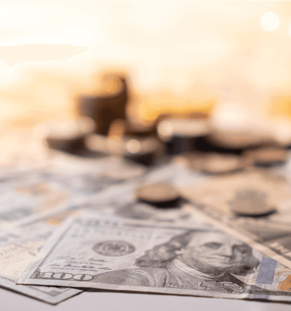 Close-up of US dollar bills and coins symbolizing financial transactions