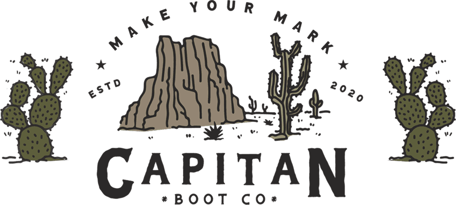 Woman wearing sleeveless black midi dress with white floral print, styled with black oxford shoes against tropical leaves