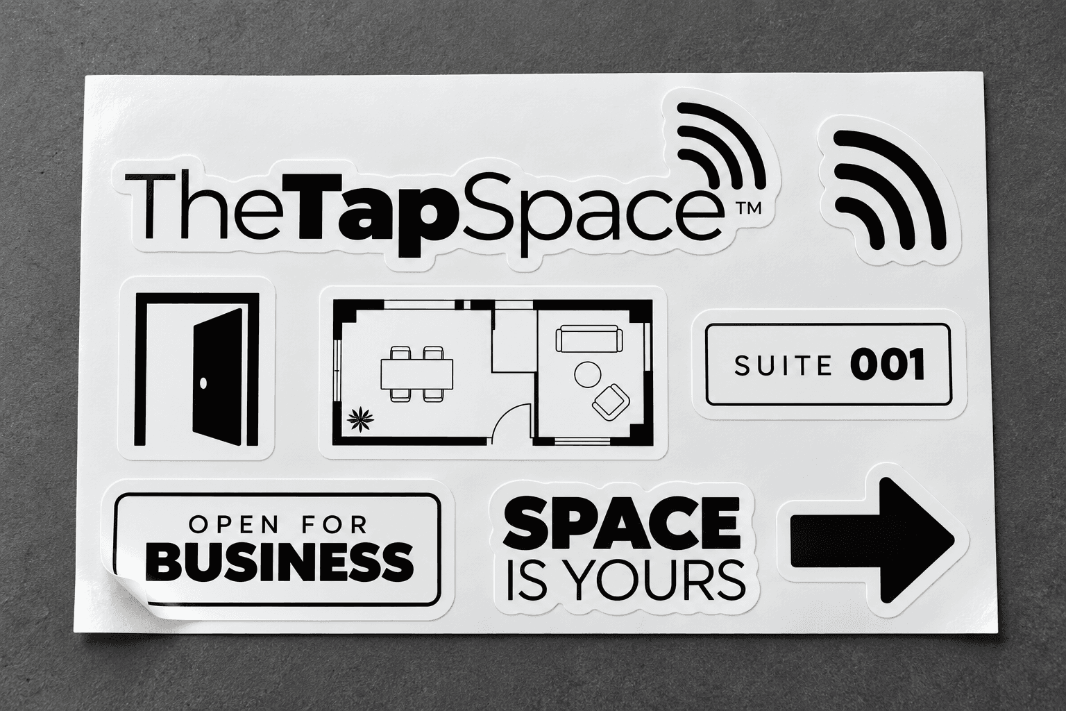 TheTapSpace sticker sheet with logo, signal mark, suite plaque and arrows