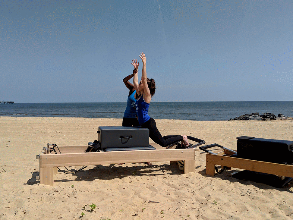 a woman is doing a piyoma exercise in a gym