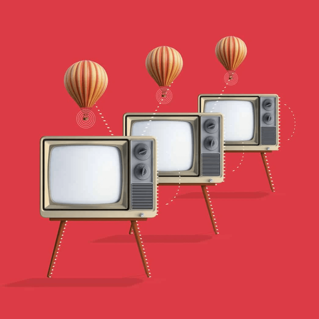 Televisores retro con globos aerostáticos sobre fondo rojo