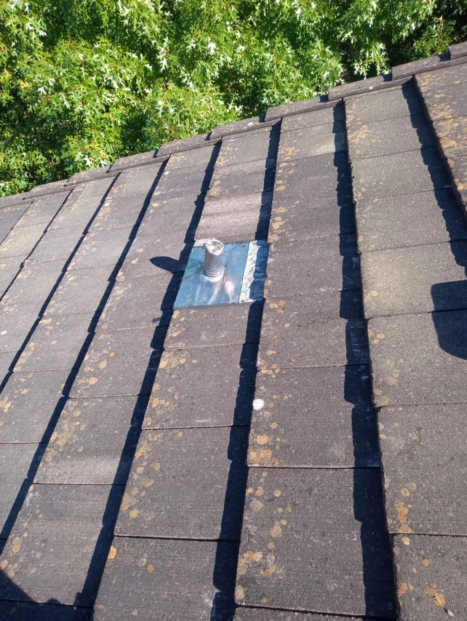 Finished repair: tile-roof pipe flashing and decking repair in San Antonio, Texas.
