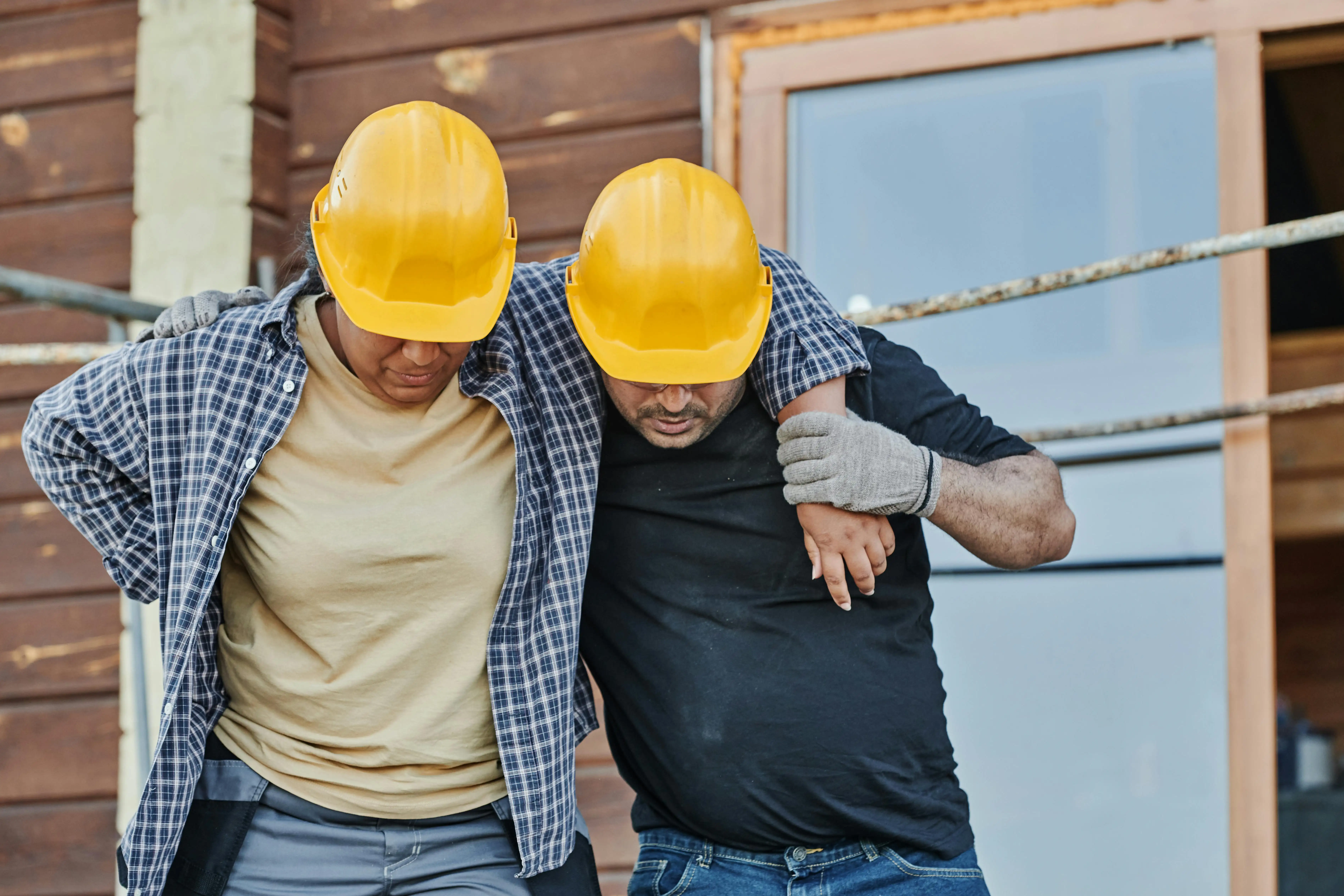 A Worker Supporting an Injured Co-Worker