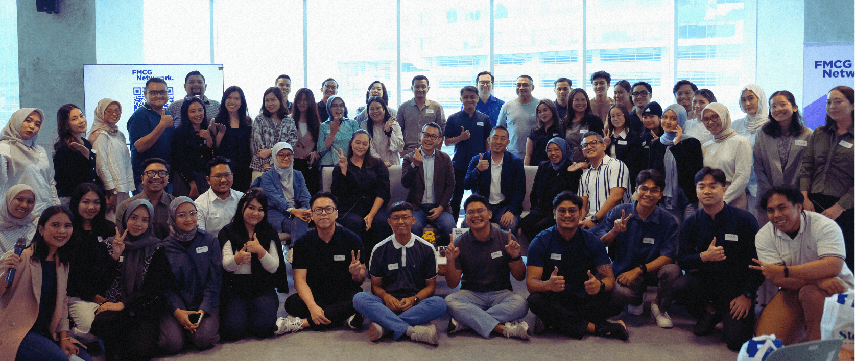 a woman sitting on a roof talking on a cell phone