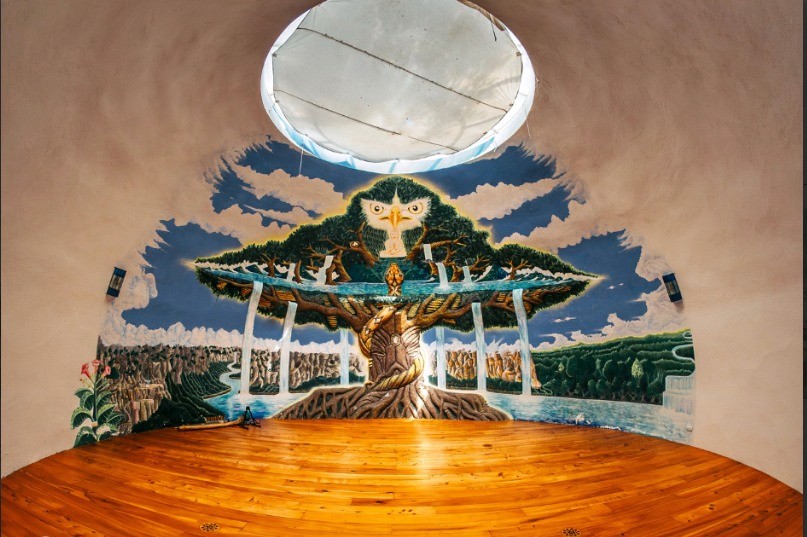 Close up of a woman with eyes closed practicing deep breathing