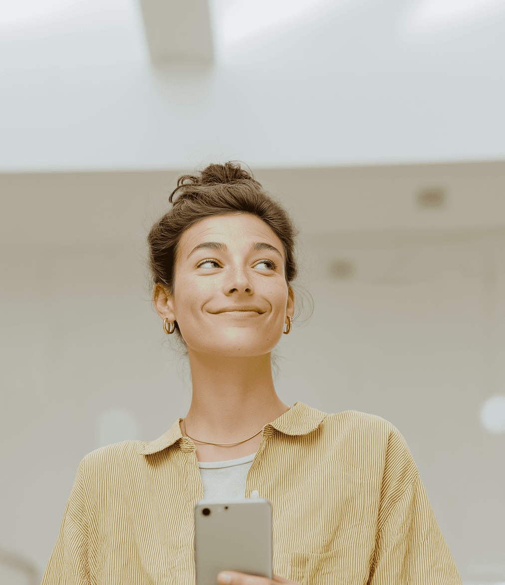 Female professional multitasking in an office setting, discussing data over the phone