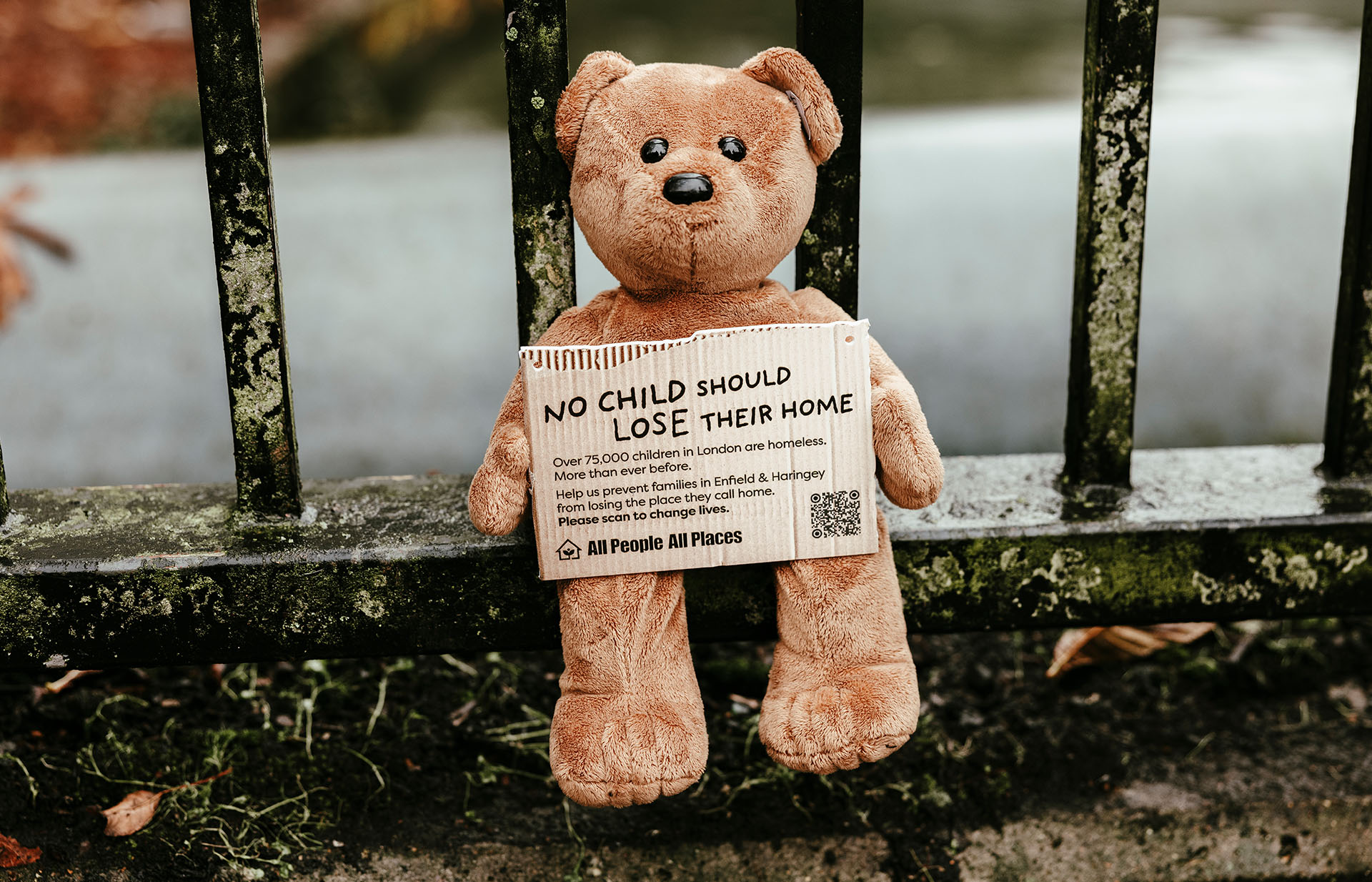 A billboard with real clothes and useful items stuck to it on a wall in London. It reads Evicition Survival Kit