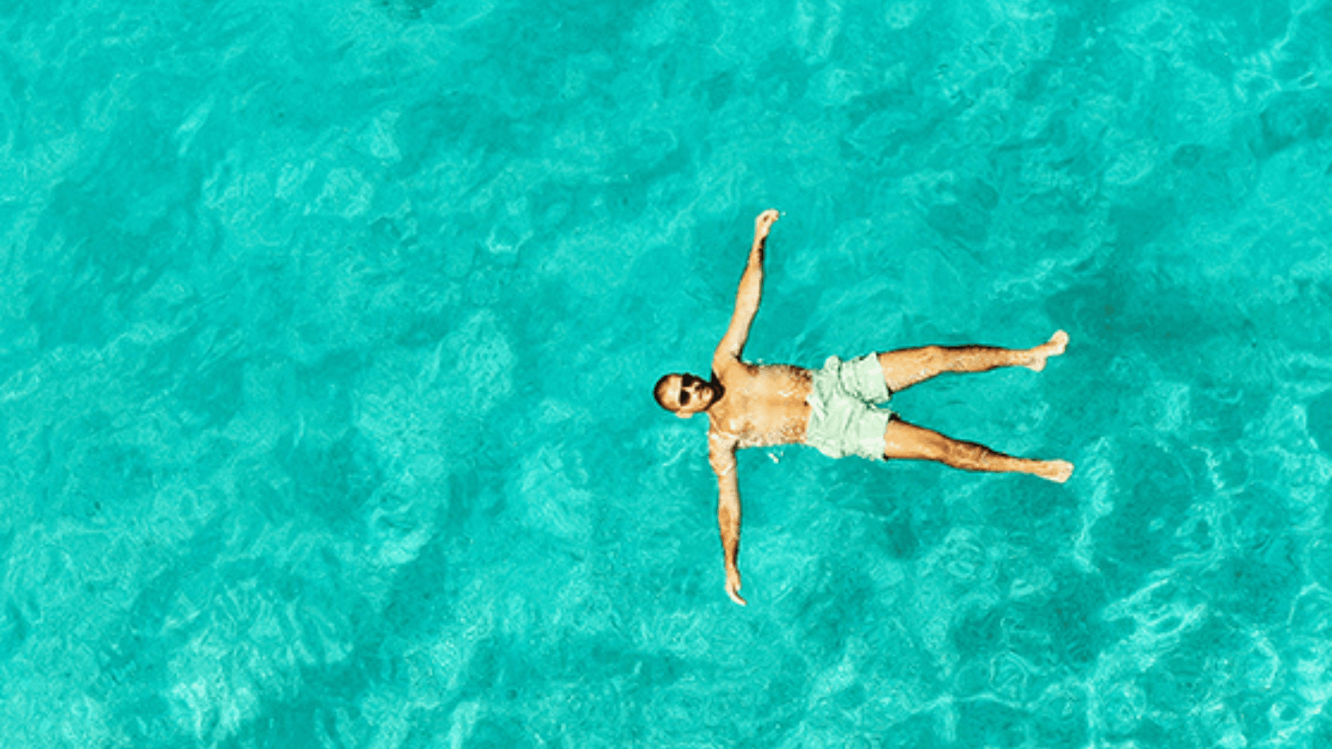 A person enjoying a swim while on a SAGA cruise