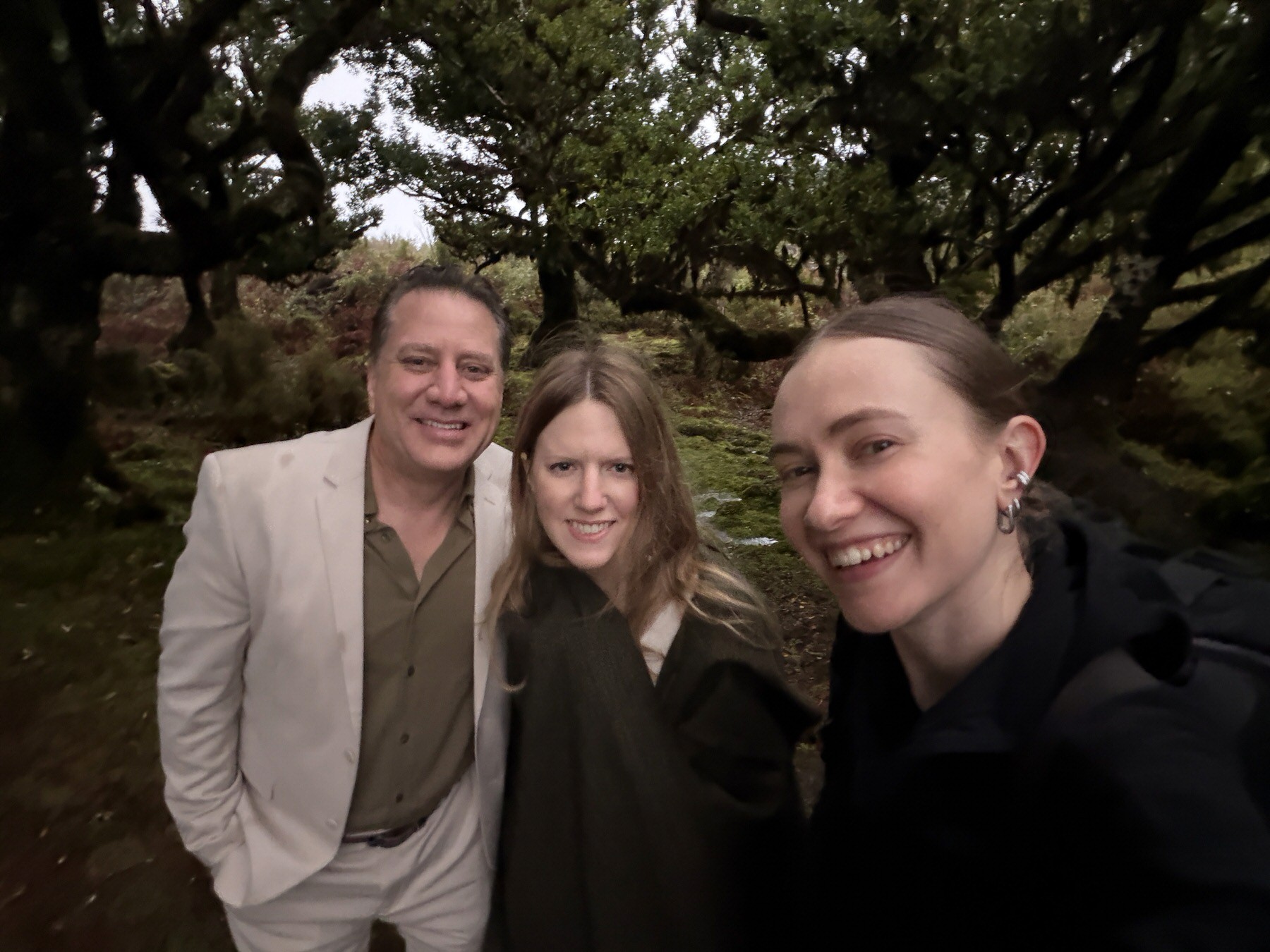 happy elopement couple with their photographer planner