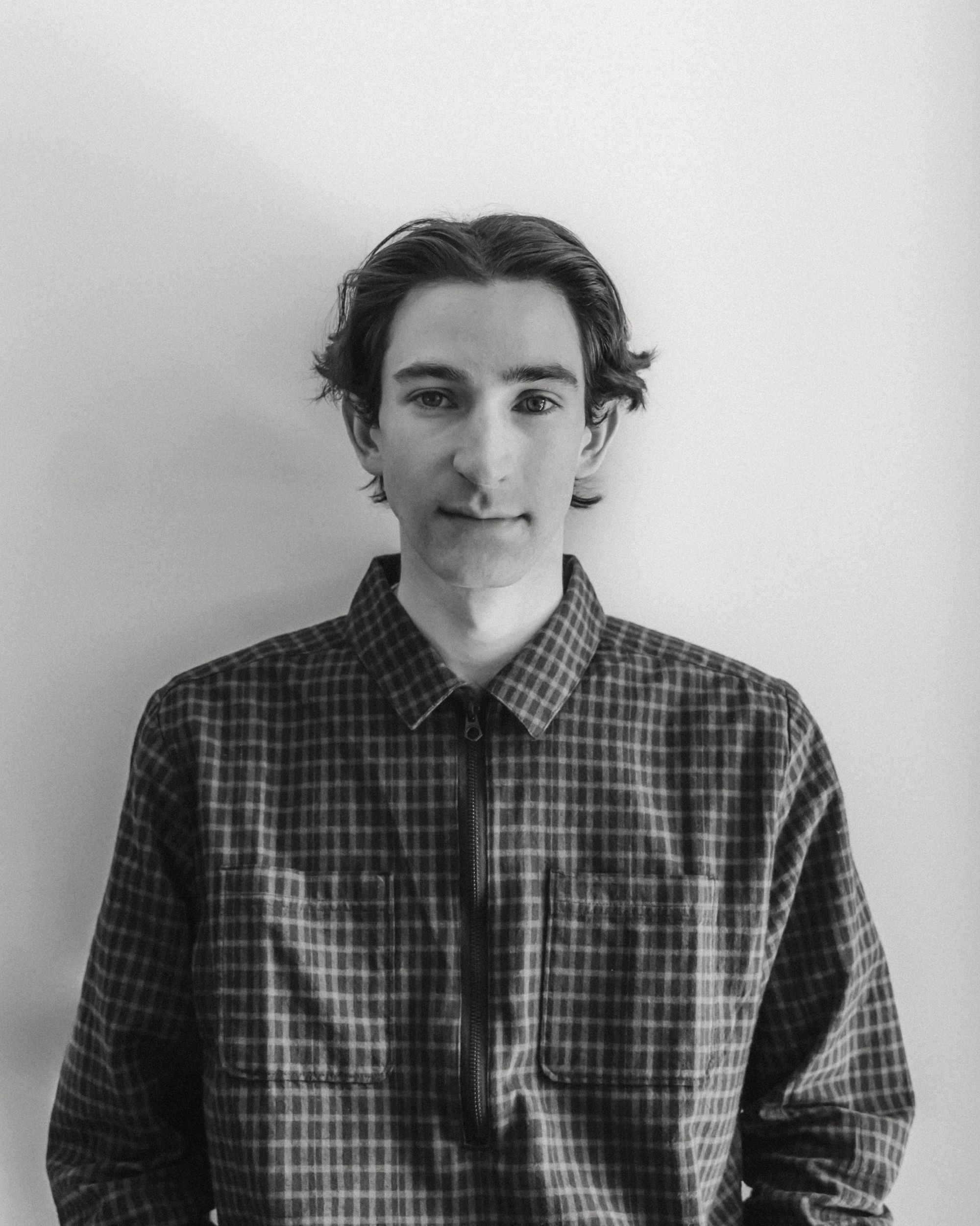 a blurry photo of a person standing in front of a wall