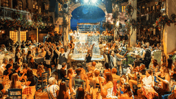 Publikum til Mamma Mia! The Party nyder en aften med sang, dans og lækker mad.