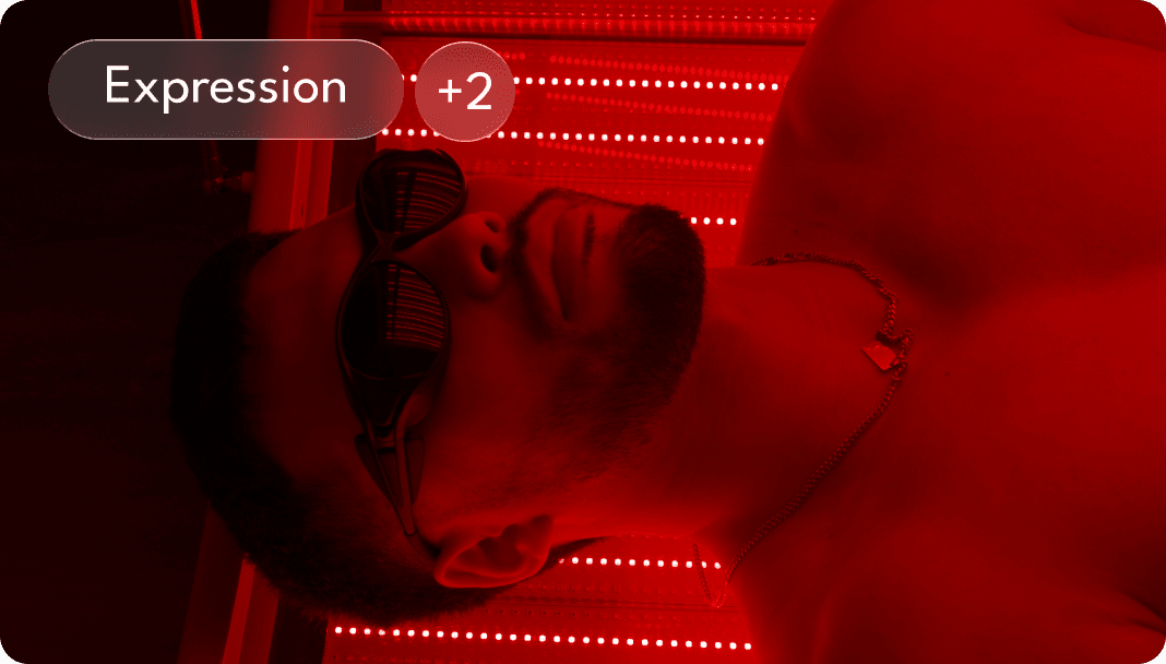 A small, dark flask is nestled among twigs and leaves on a forest floor, with a muted, mysterious ambiance.