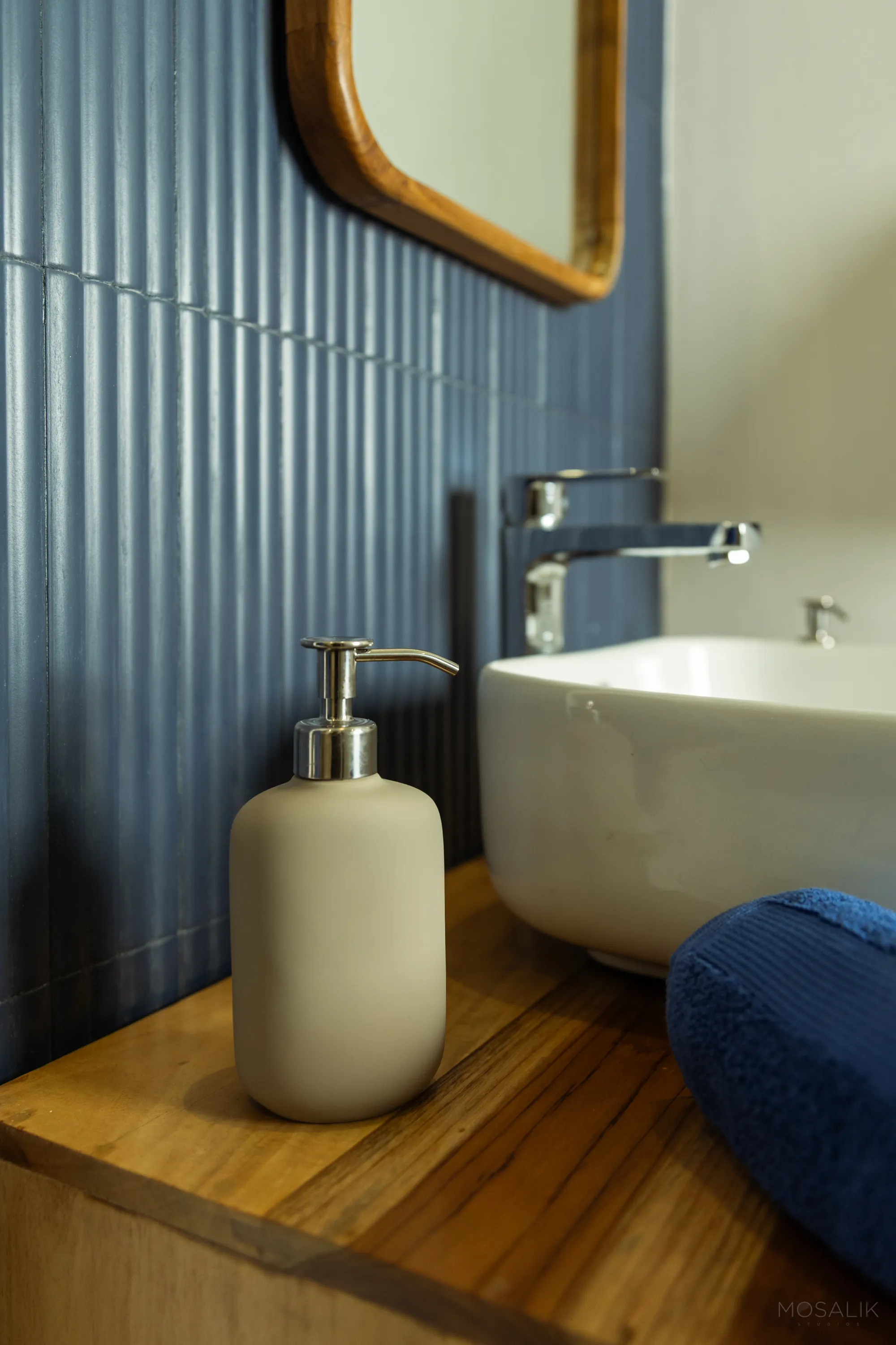 Basin against blue corrugated panelling at Jaali Blue