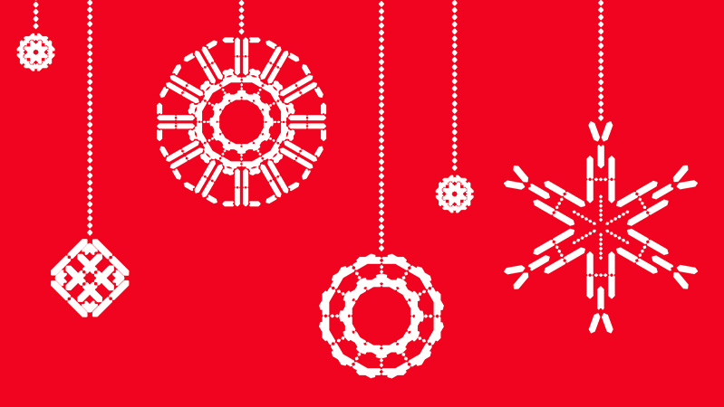 white circles and snowflakes shapes as Christmas tree decorations on a red background