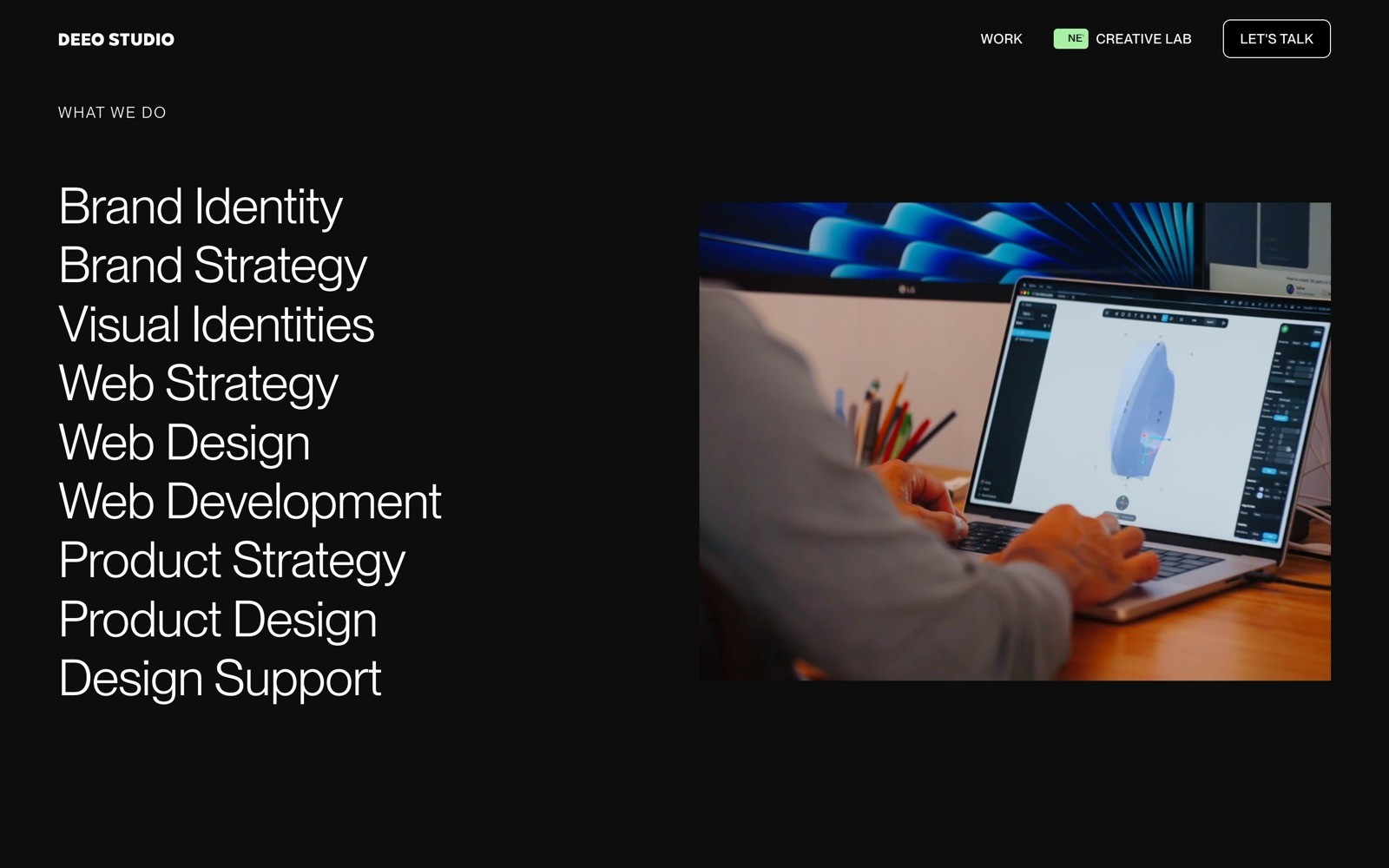 Designer working on a laptop next to a list of services: Brand Identity, Web Design, Product Strategy, and more.
