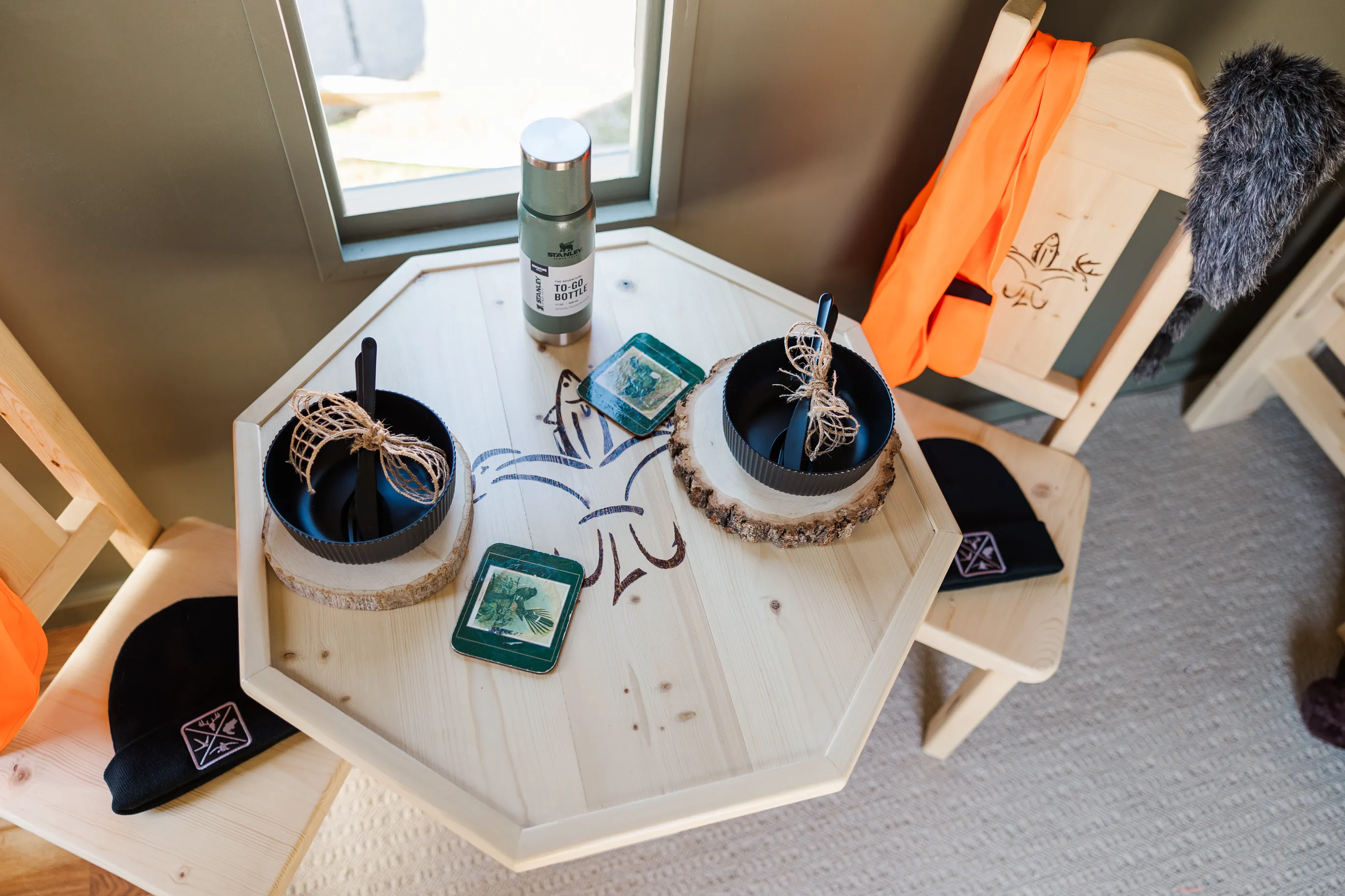 Luxury table setting by Sarah Overall Events with pink embroidered napkins, gold-rimmed plates, floral arrangements, and personalized menus in Shreveport.