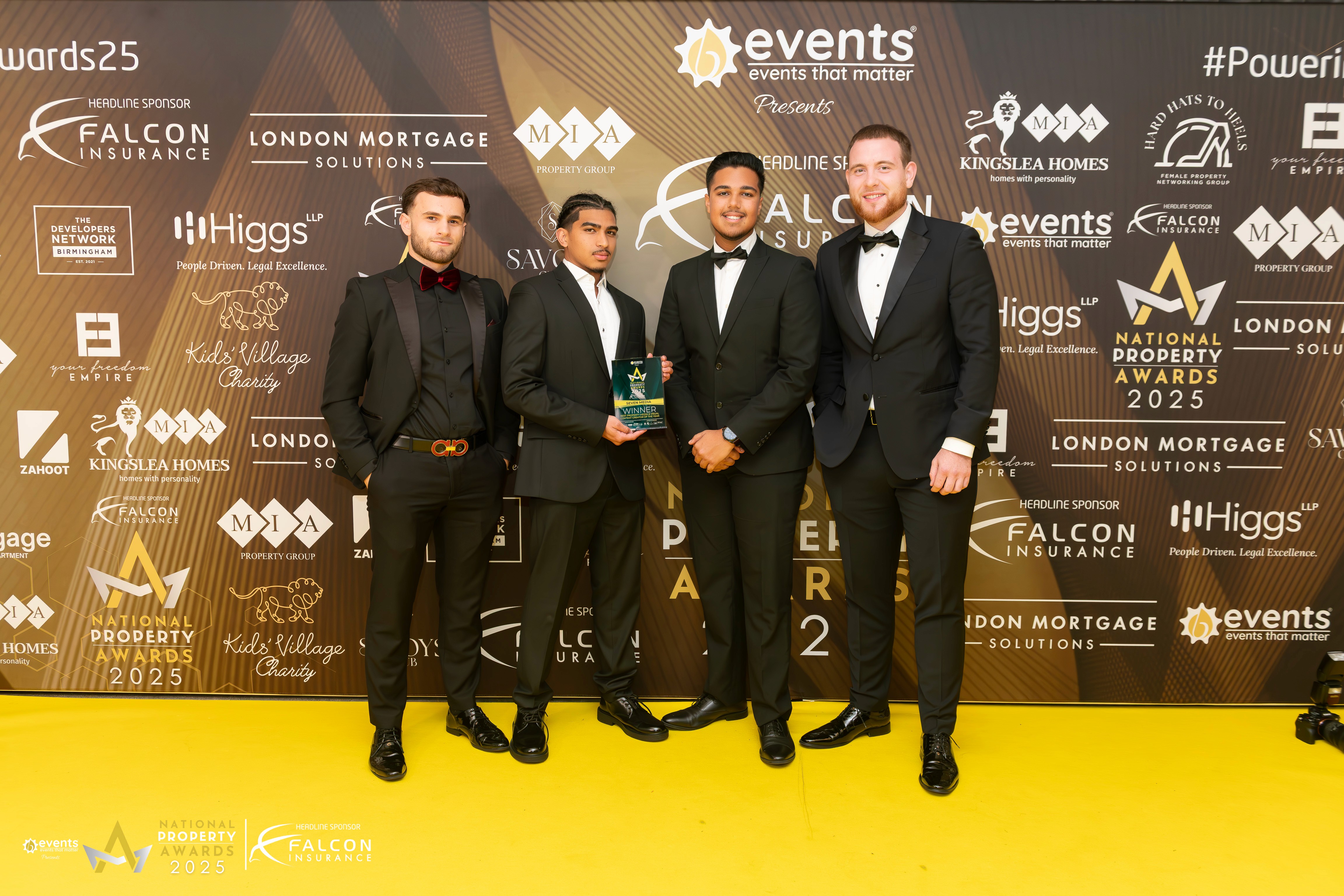 Woman in conical hat rides bicycle down street.