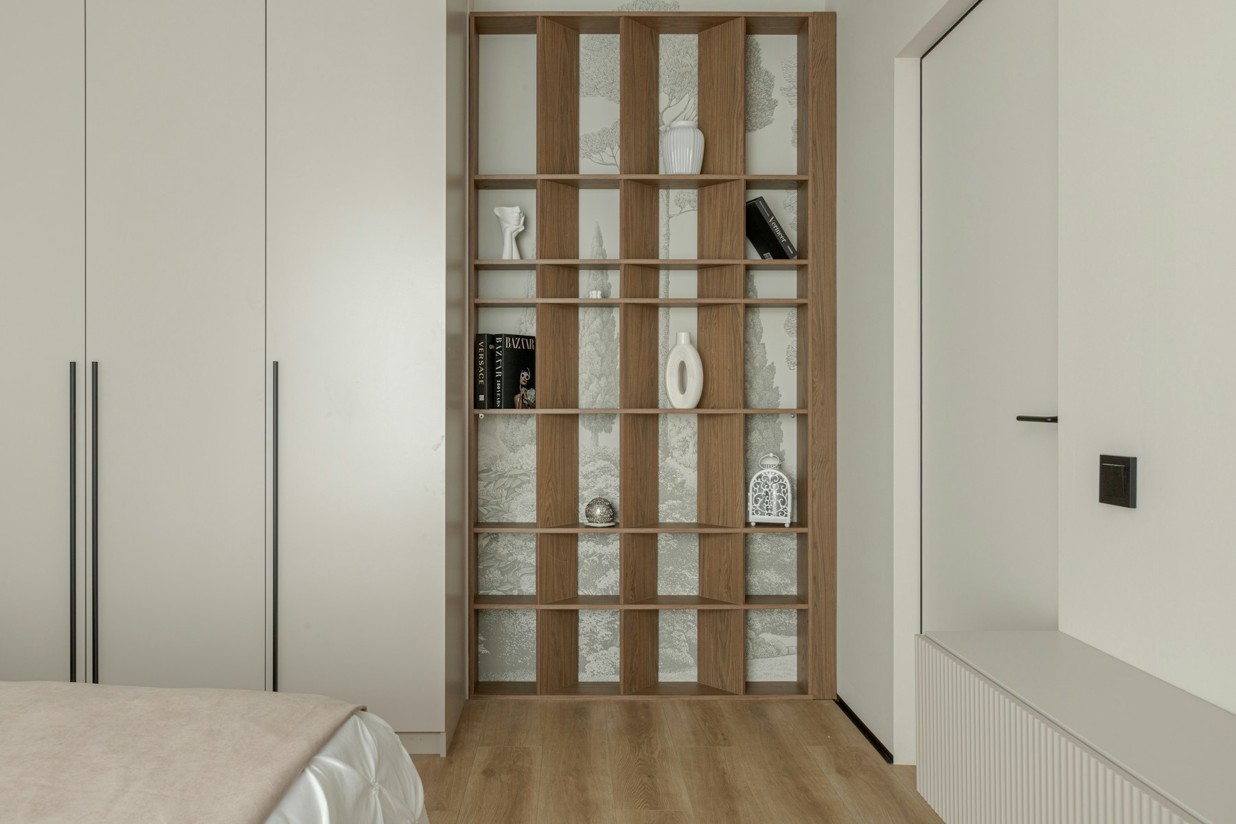 Floor-to-ceiling white wardrobes with an open shelving unit