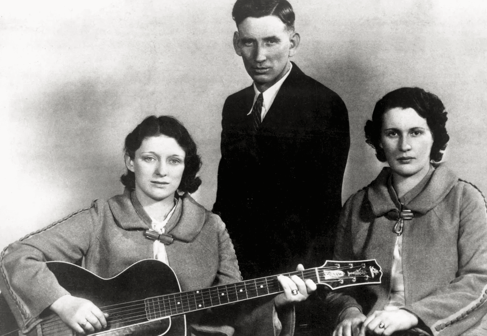 The Carter Family country music group with a guitar