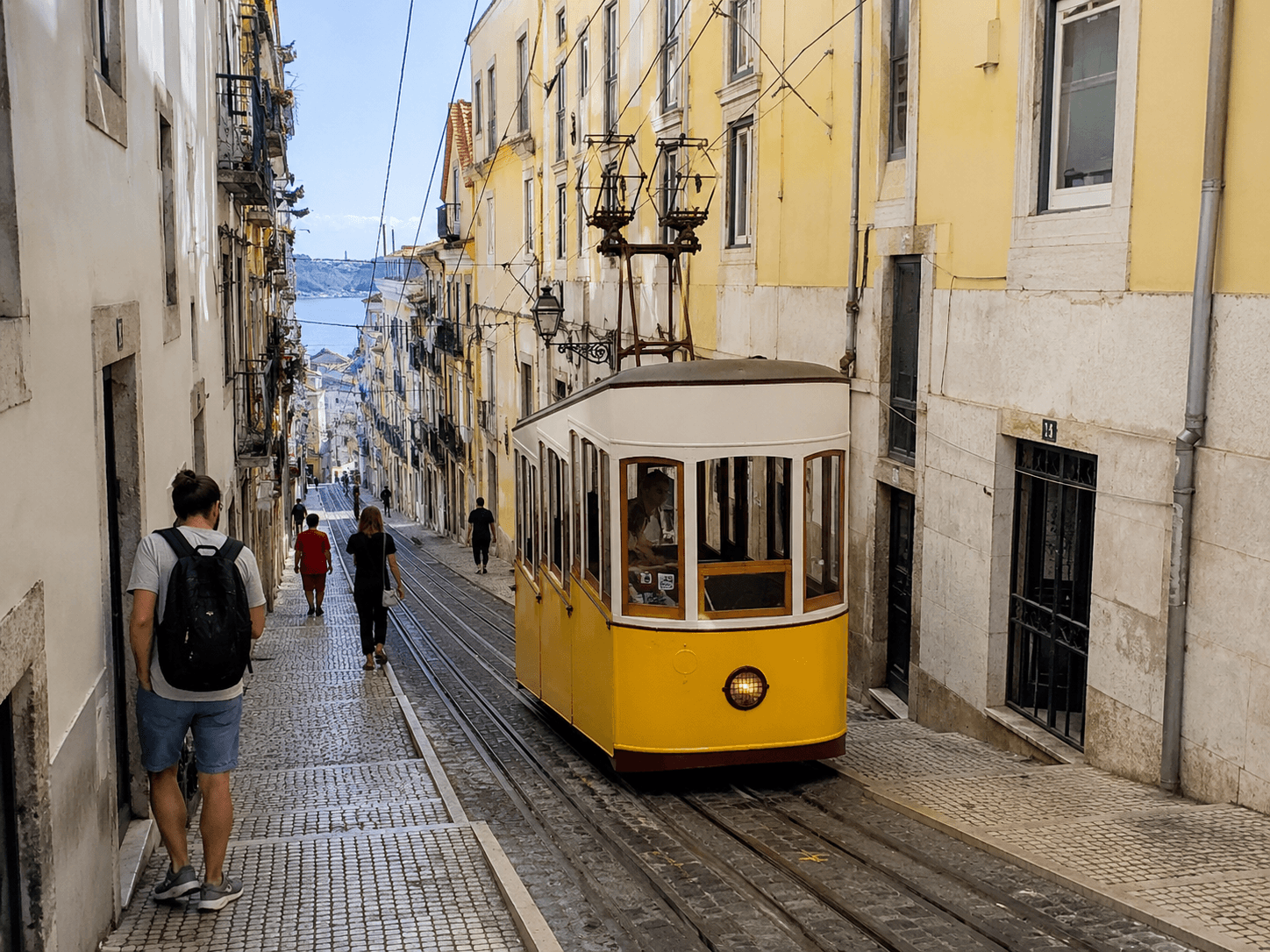 Yellow Ascensor da Bica funicular on Rua da Bica in Lisbon