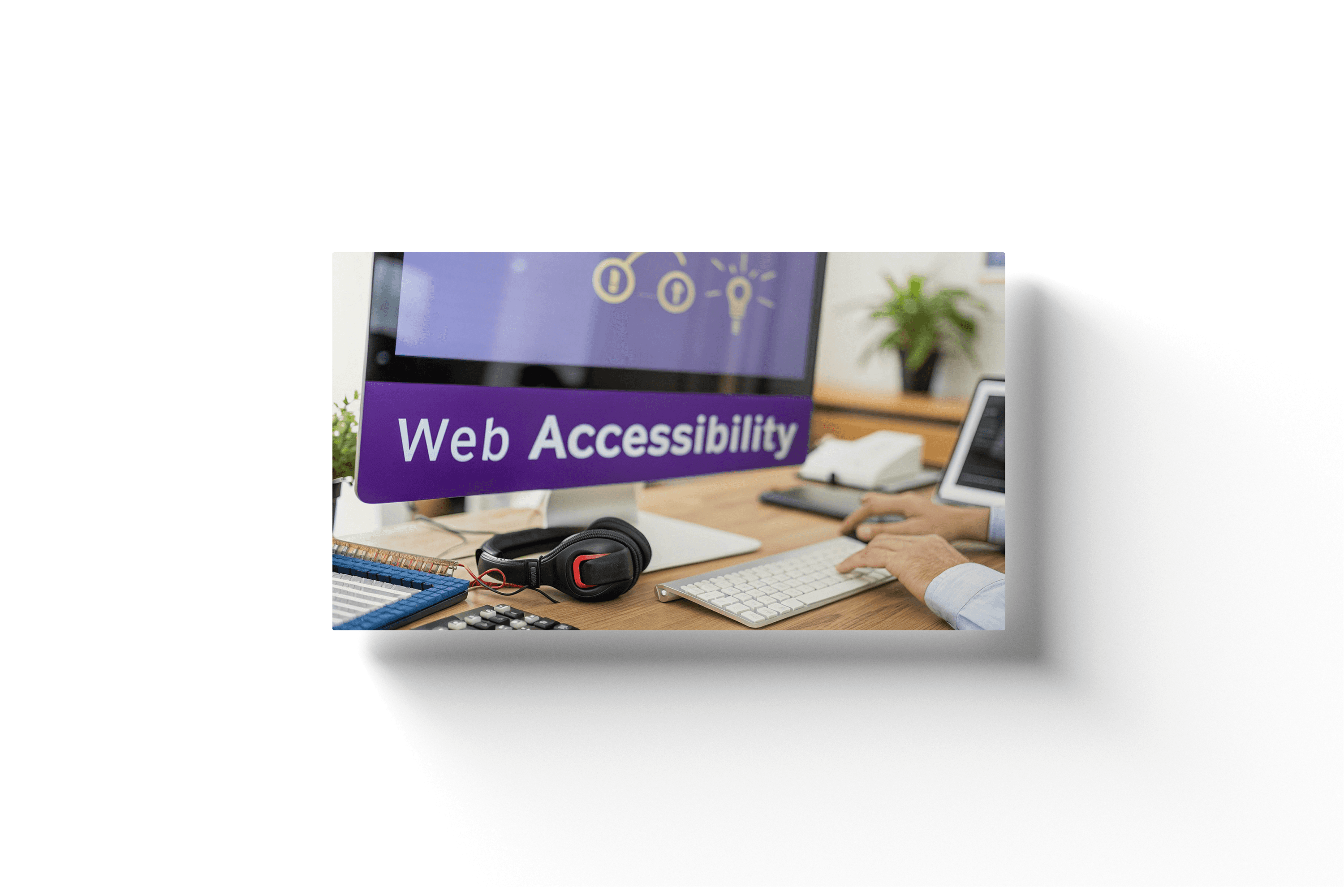 a desktop computer with a purple screen showing the text 'web accessibility'