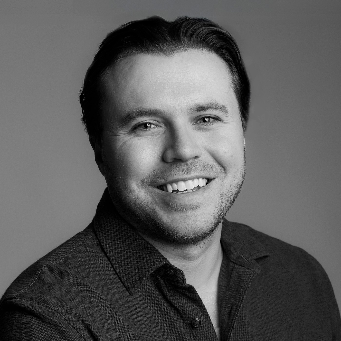 Professional headshot of Teddy Ellison